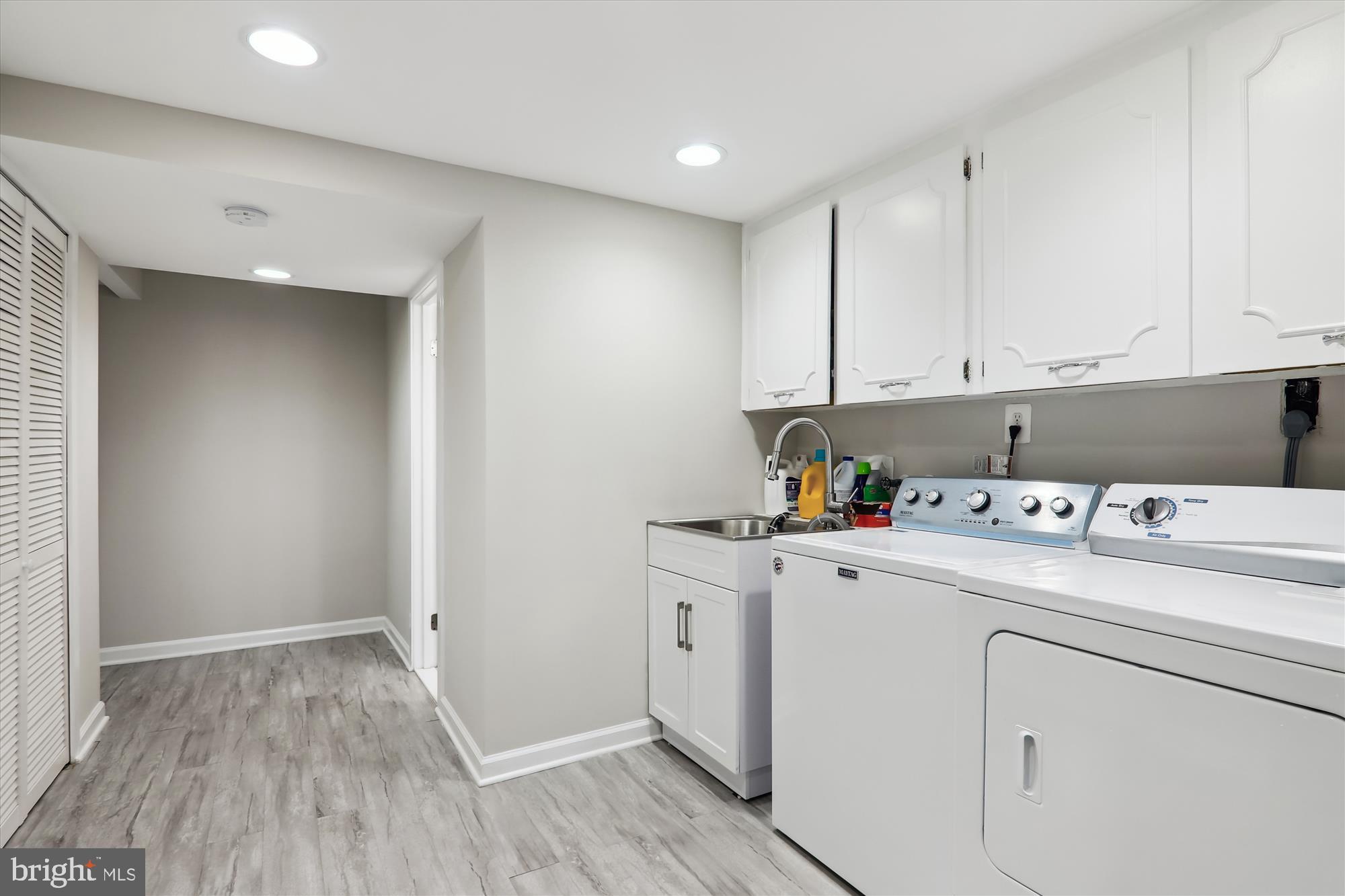 11804 Lovejoy Street Silver Spring, MD 20902 - Photo 34 of 45 a view of storage and utility room with washer and dryer