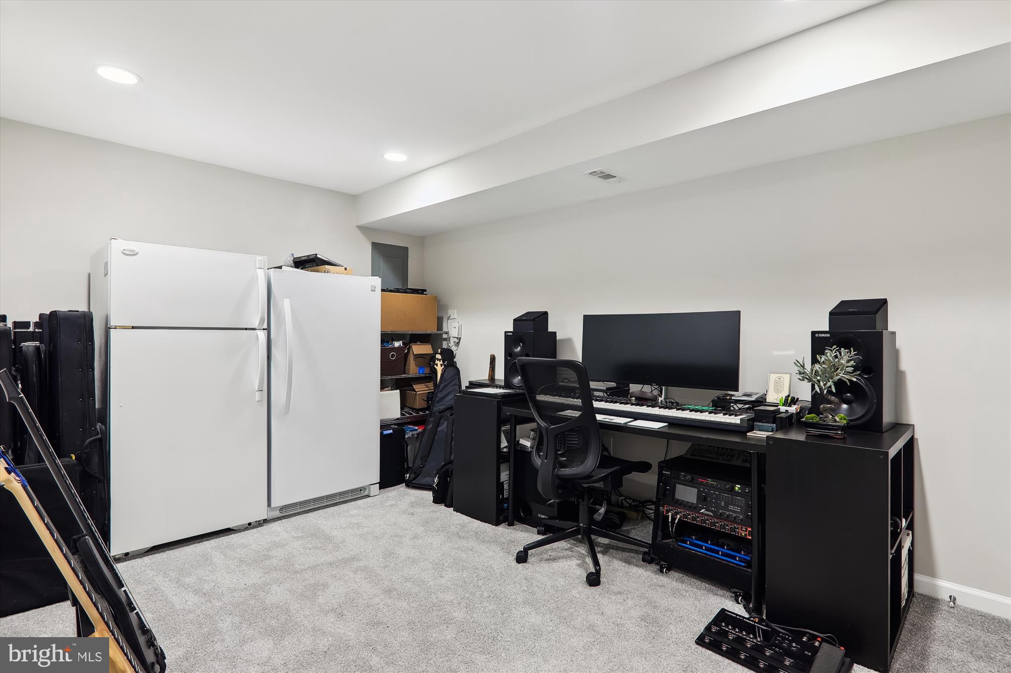 11804 Lovejoy Street Silver Spring, MD 20902 - Photo 35 of 45 a view of a workspace with furniture and a refrigerator