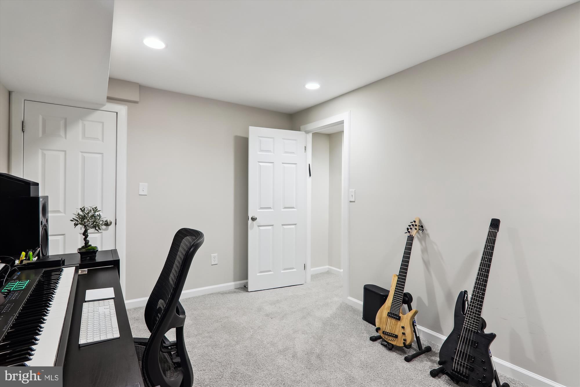 11804 Lovejoy Street Silver Spring, MD 20902 - Photo 36 of 45 a view of a workspace with furniture and a flat screen tv