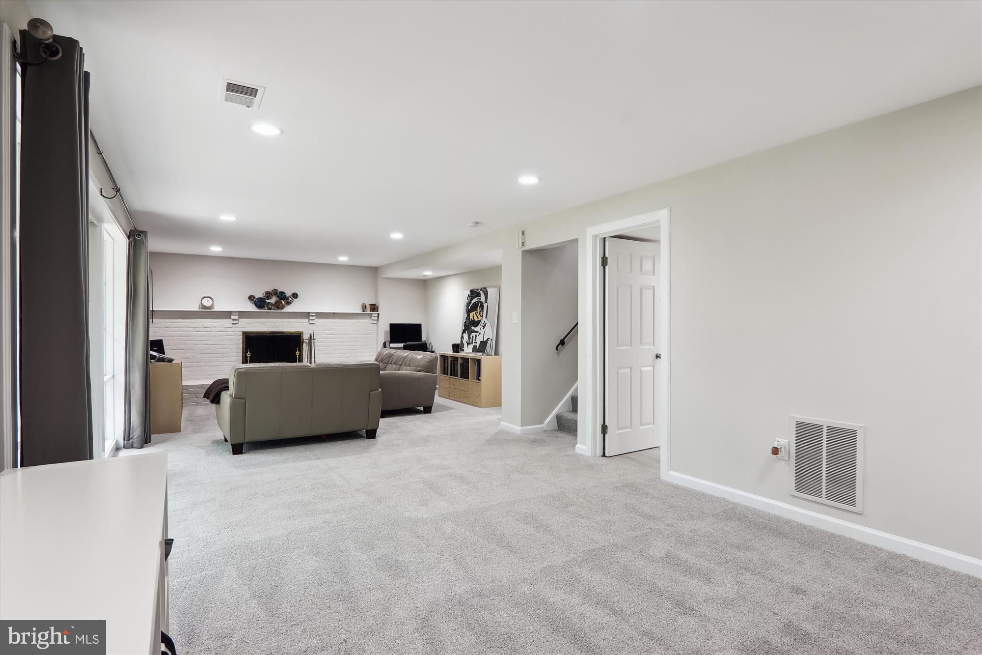 11804 Lovejoy Street Silver Spring, MD 20902 - Photo 37 of 45 a living room with furniture and a flat screen tv
