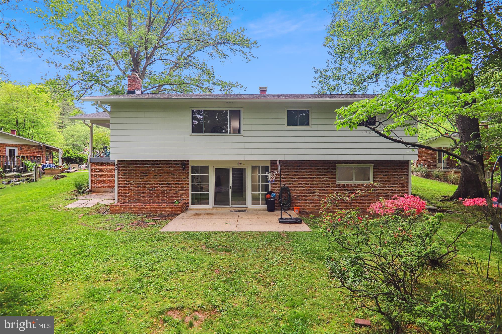 11804 Lovejoy Street Silver Spring, MD 20902 - Photo 42 of 45 a front view of a house with a garden and trees