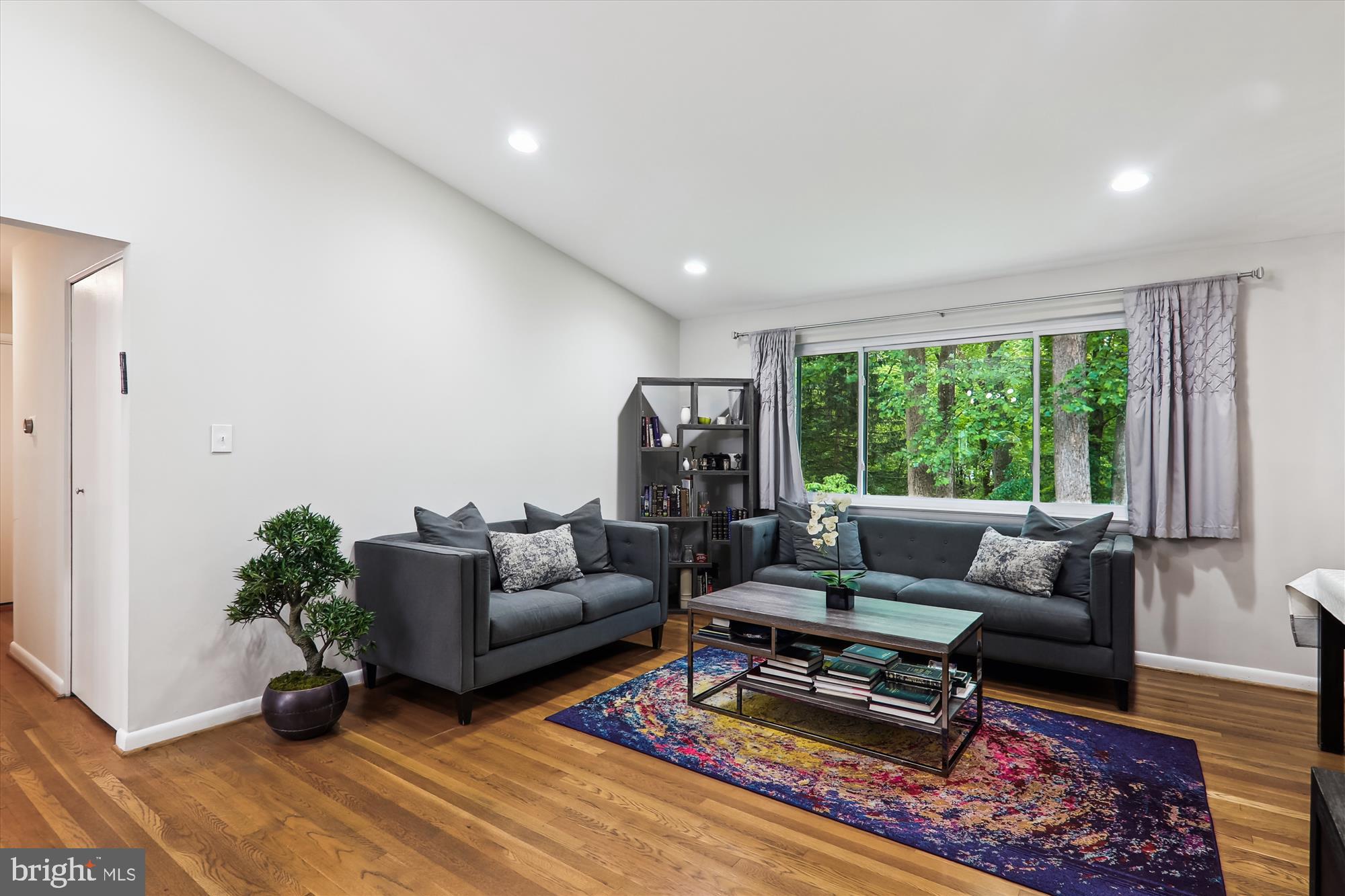 11804 Lovejoy Street Silver Spring, MD 20902 - Photo 7 of 45 a living room with furniture and a wooden floor