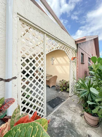 a flower garden is sitting in front of a house