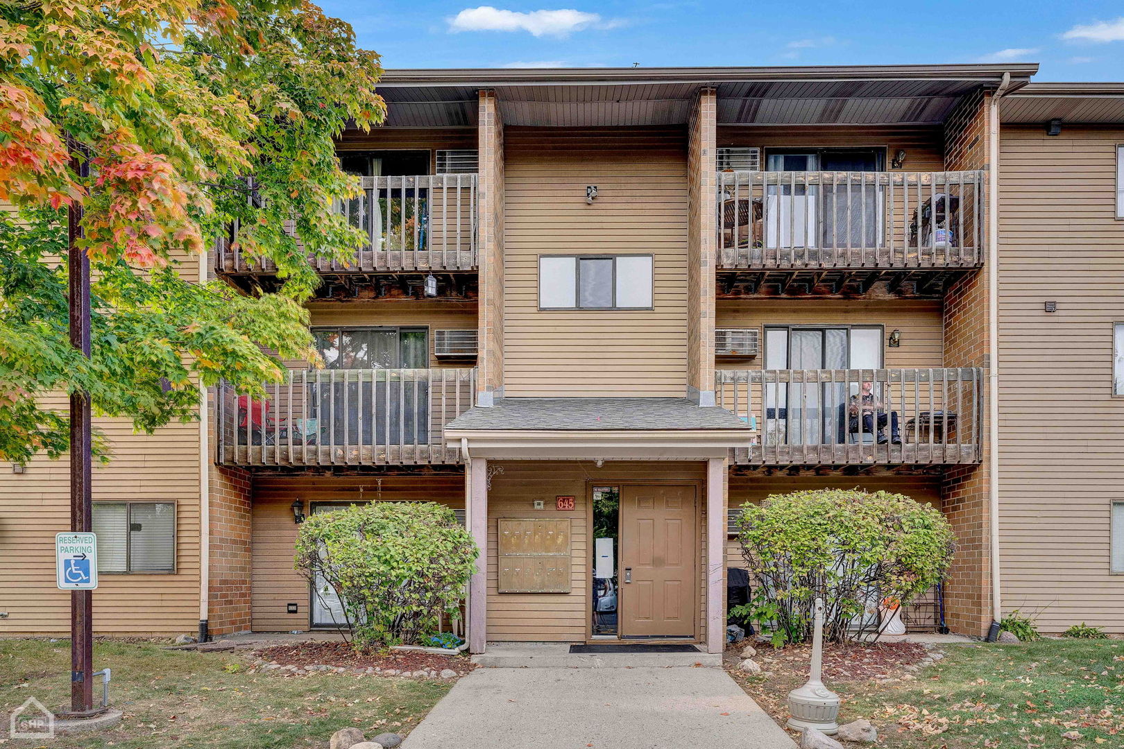 645 South Virginia Road, Unit 123 Crystal Lake, IL 60014 - Photo 1 of 17 a front view of a house with plants