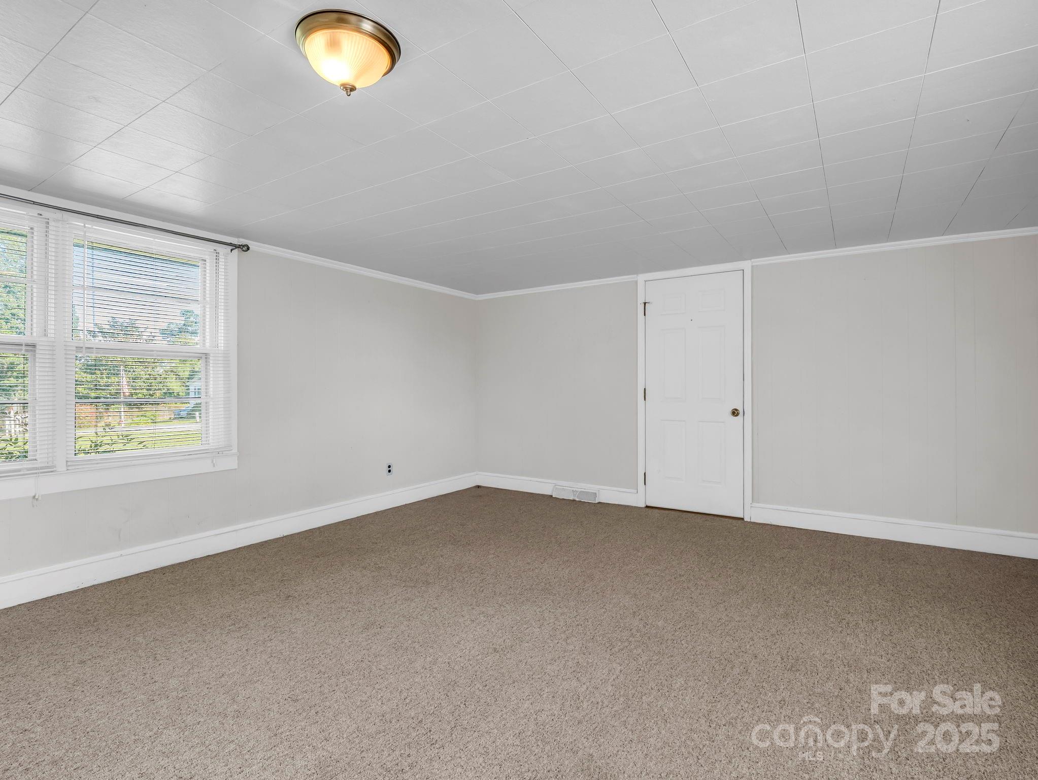 264 Goode Road Mooresboro, NC 28114 - Photo 11 of 36 an empty room with windows