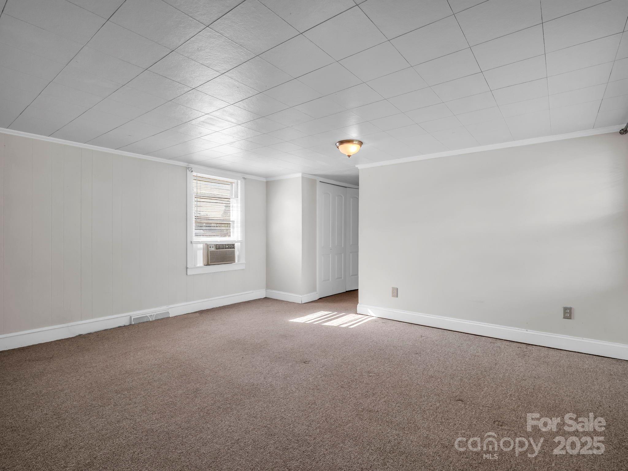264 Goode Road Mooresboro, NC 28114 - Photo 12 of 36 an empty room with windows