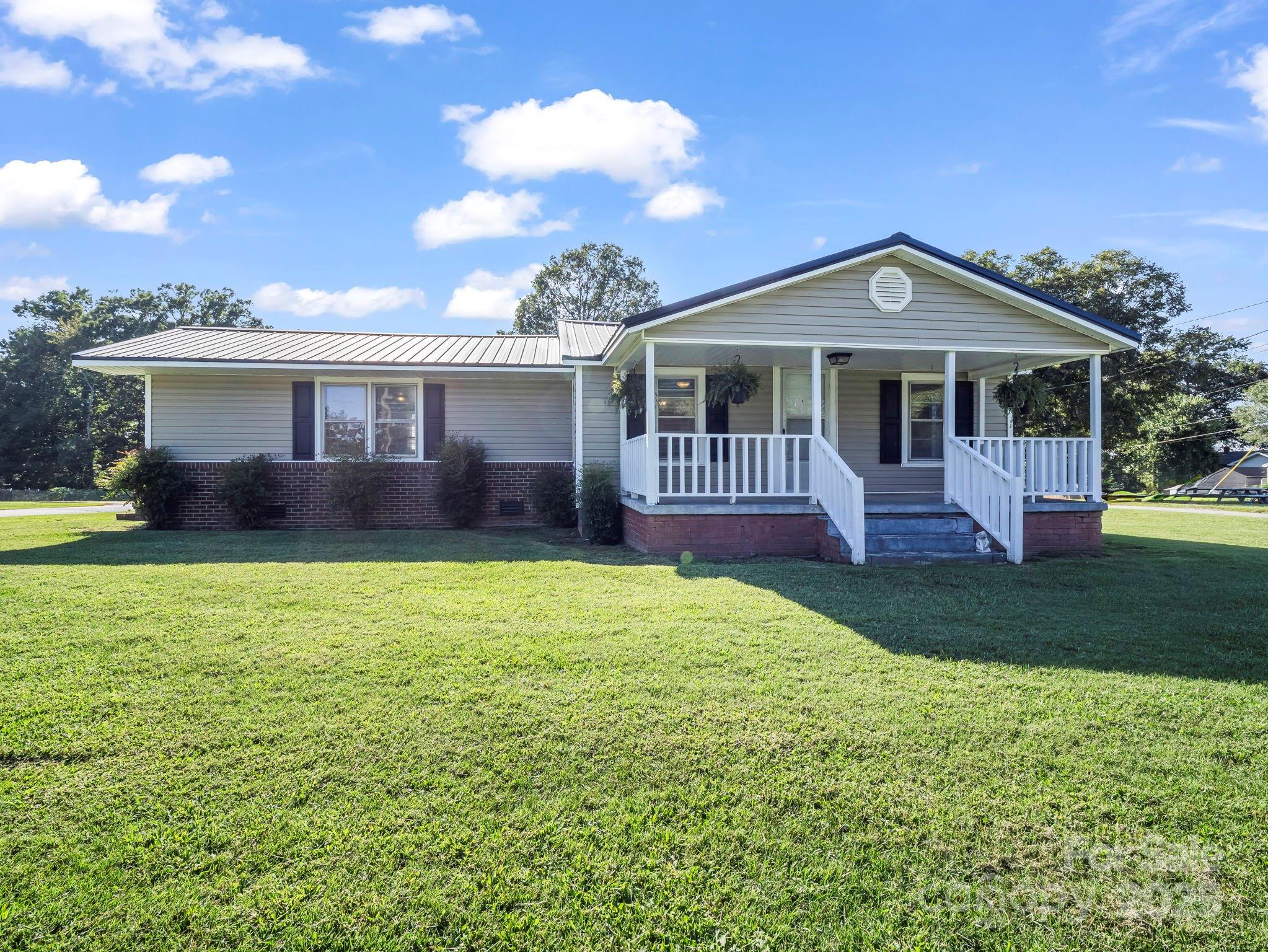 264 Goode Road Mooresboro, NC 28114 - Photo 21 of 36 a front view of a house with garden