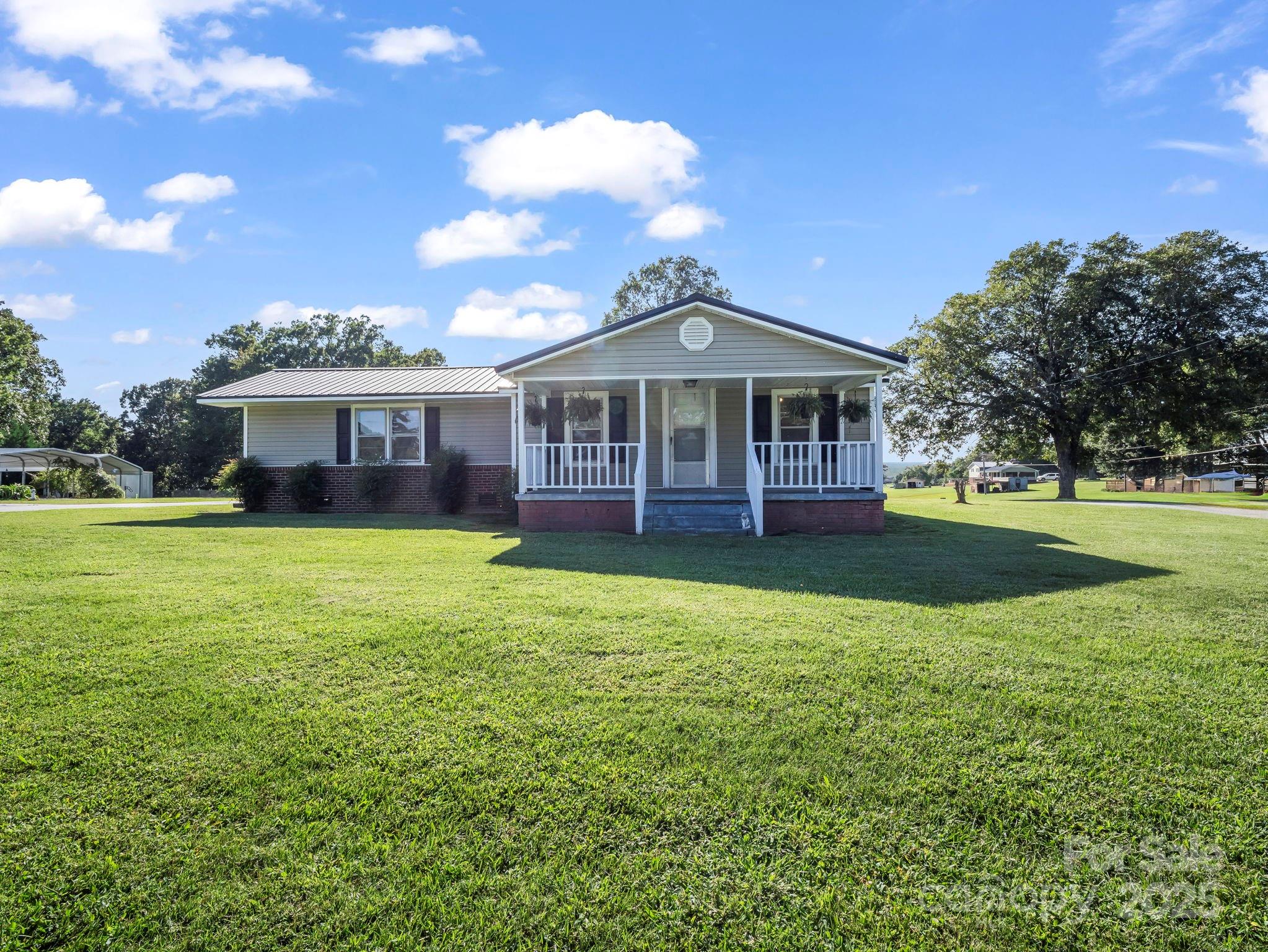264 Goode Road Mooresboro, NC 28114 - Photo 22 of 36 a front view of a house with garden
