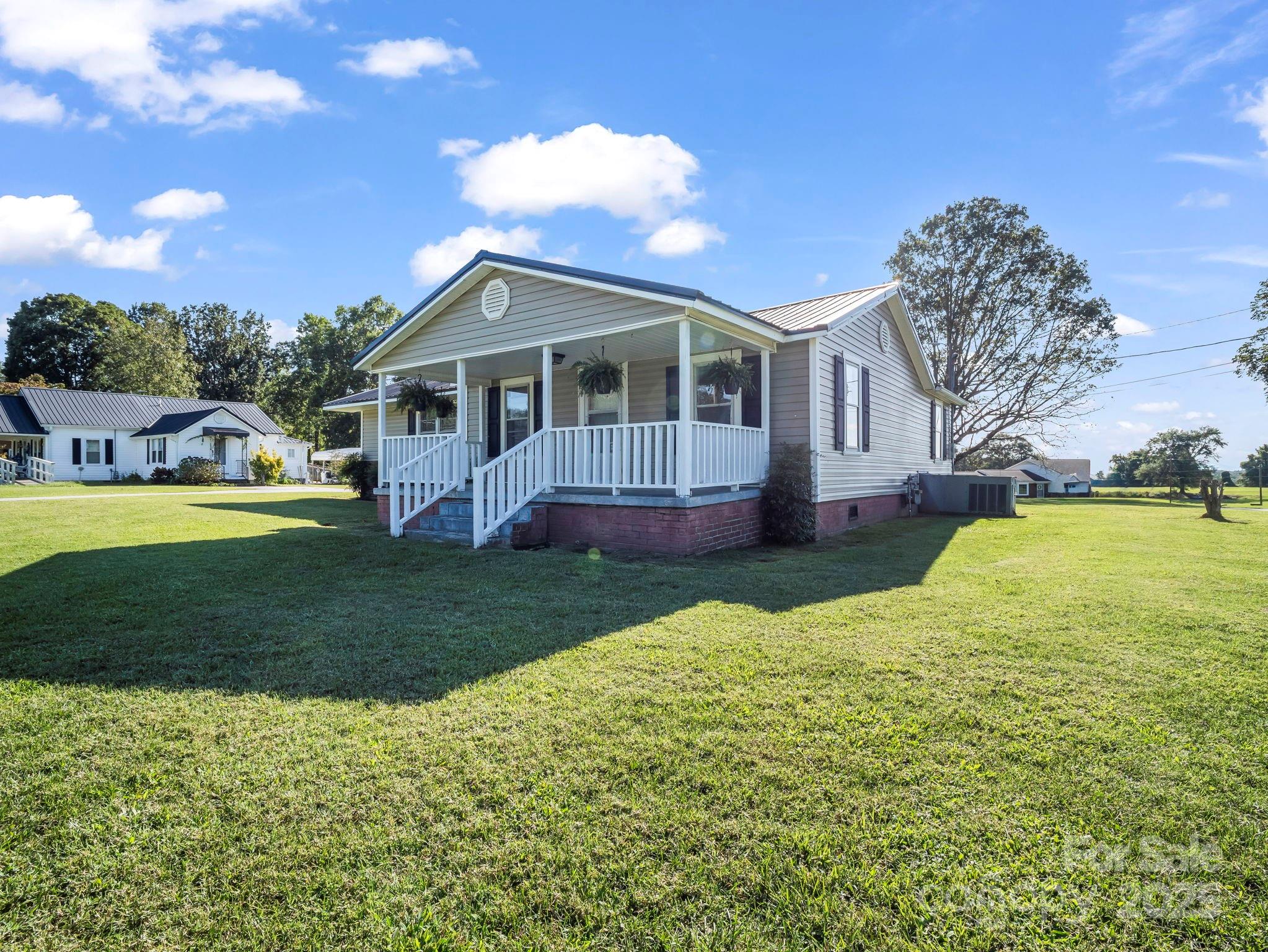 264 Goode Road Mooresboro, NC 28114 - Photo 23 of 36 a front view of a house with garden