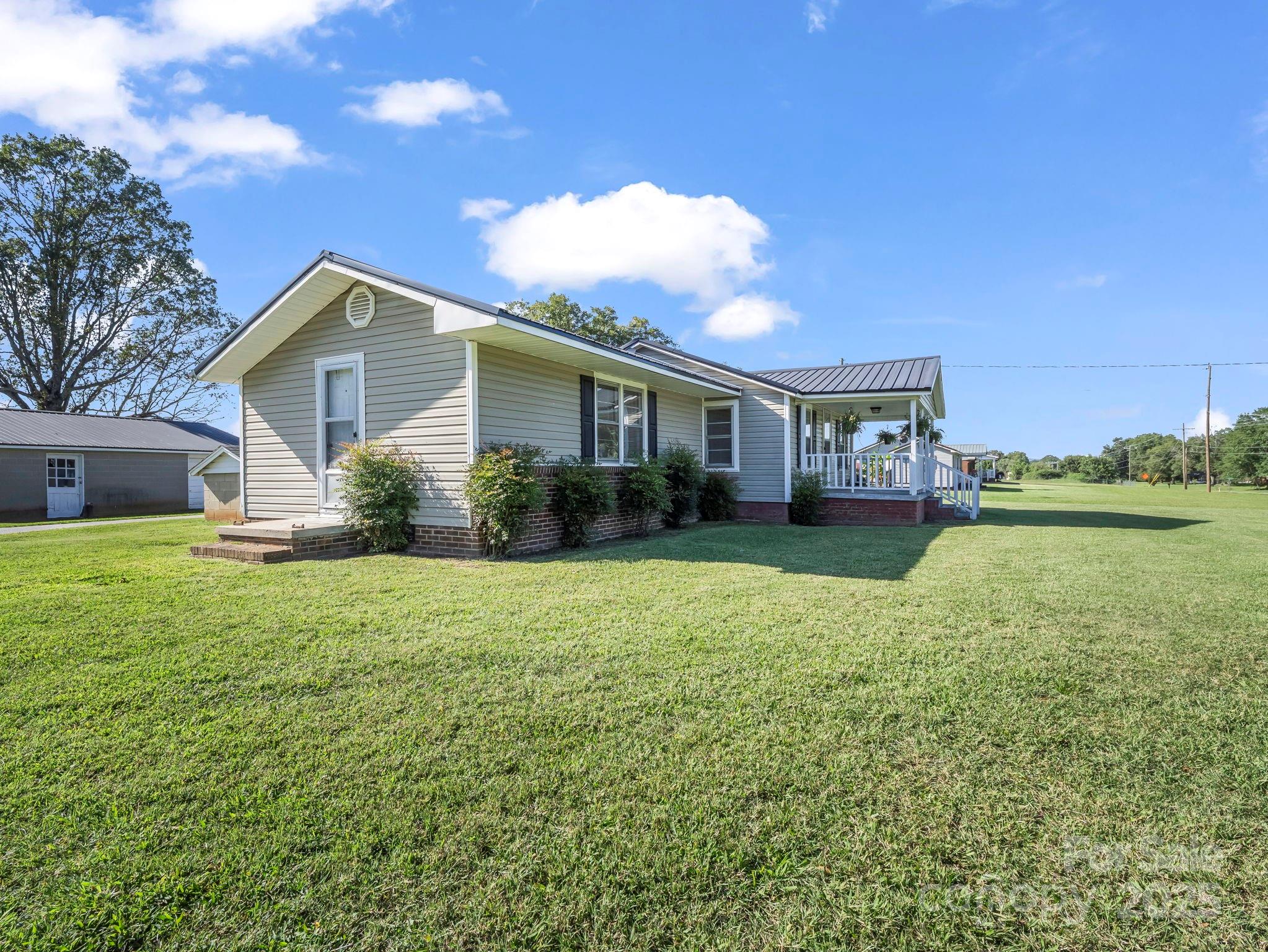 264 Goode Road Mooresboro, NC 28114 - Photo 24 of 36 a house view with a garden space