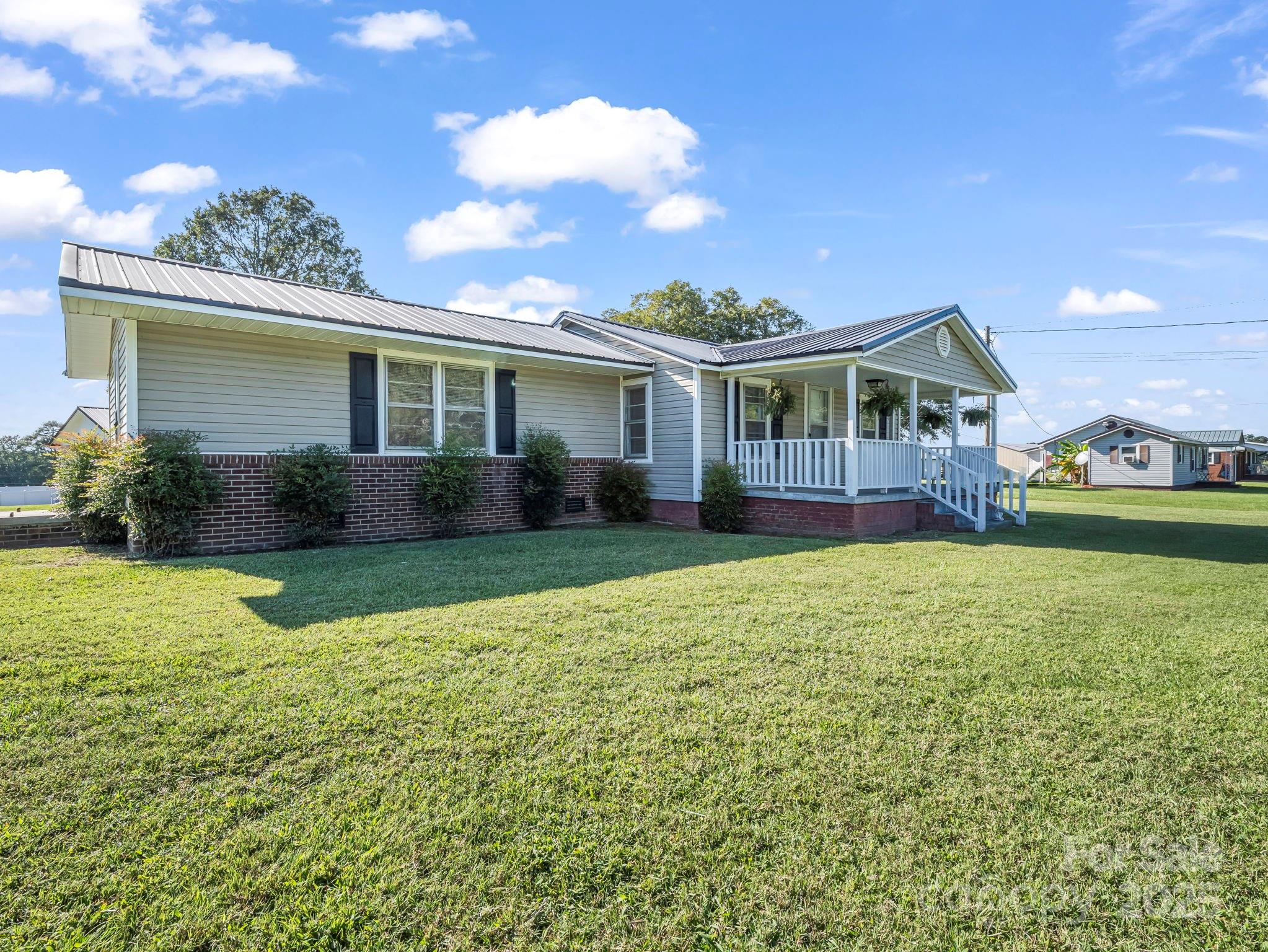 264 Goode Road Mooresboro, NC 28114 - Photo 25 of 36 front view of a house with a yard