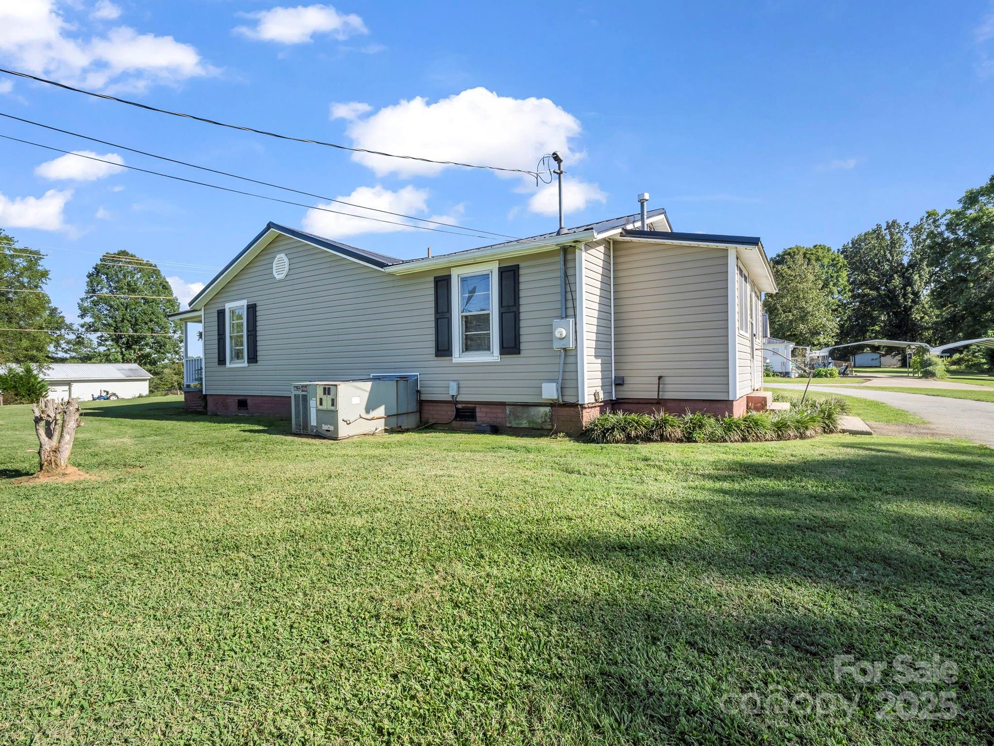 264 Goode Road Mooresboro, NC 28114 - Photo 28 of 36 a front view of house with yard and outdoor seating