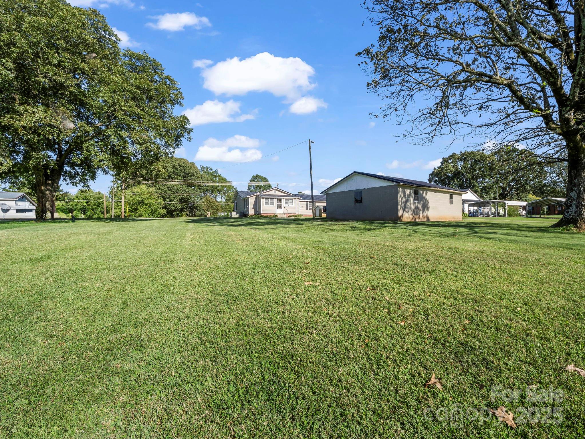 264 Goode Road Mooresboro, NC 28114 - Photo 31 of 36 a view of a house with a big yard and large trees