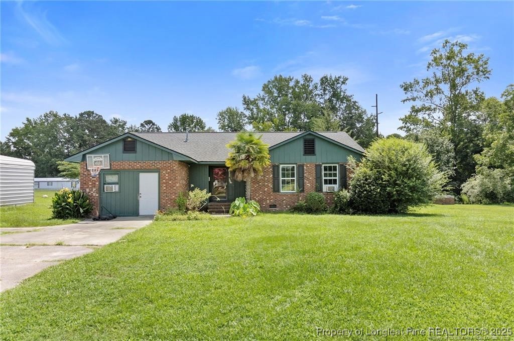 a front view of a house with yard and porch