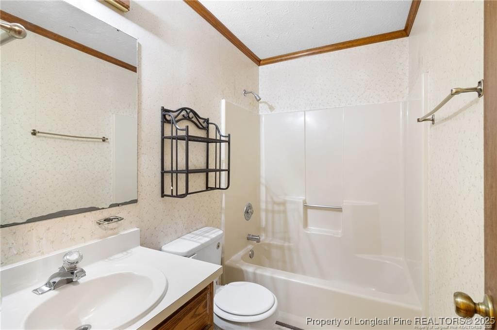 6104 Sisk Culbreth Road Godwin, NC 28344 - Photo 12 of 16 a bathroom with a sink toilet and shower