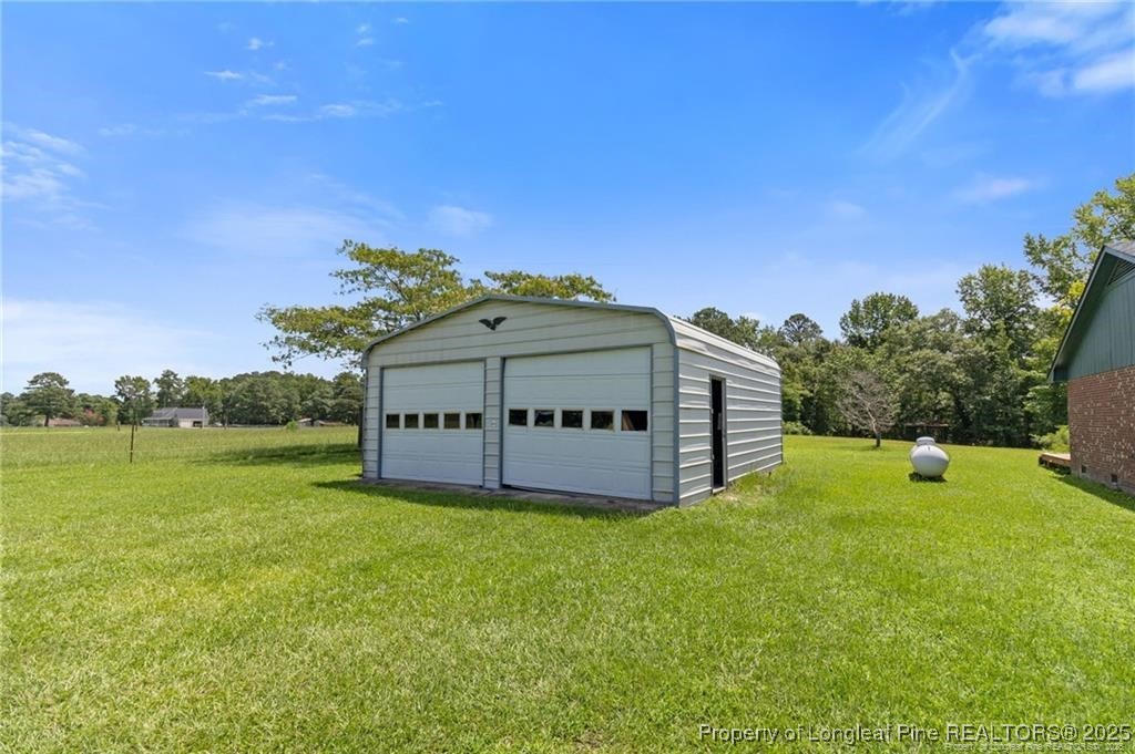 6104 Sisk Culbreth Road Godwin, NC 28344 - Photo 16 of 16 a view of a house with a yard
