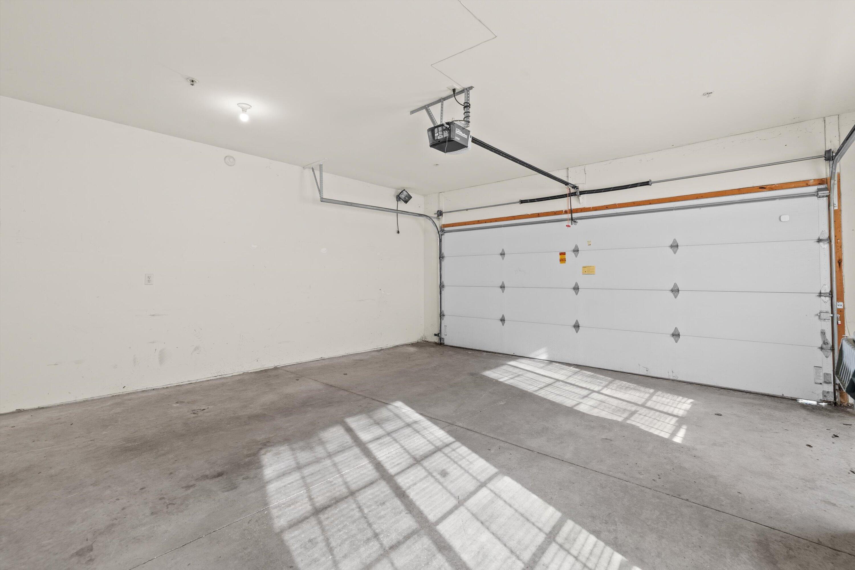 1540 Raintree Lane, Unit 128 Mount Pleasant, WI 53406 - Photo 25 of 31 garage