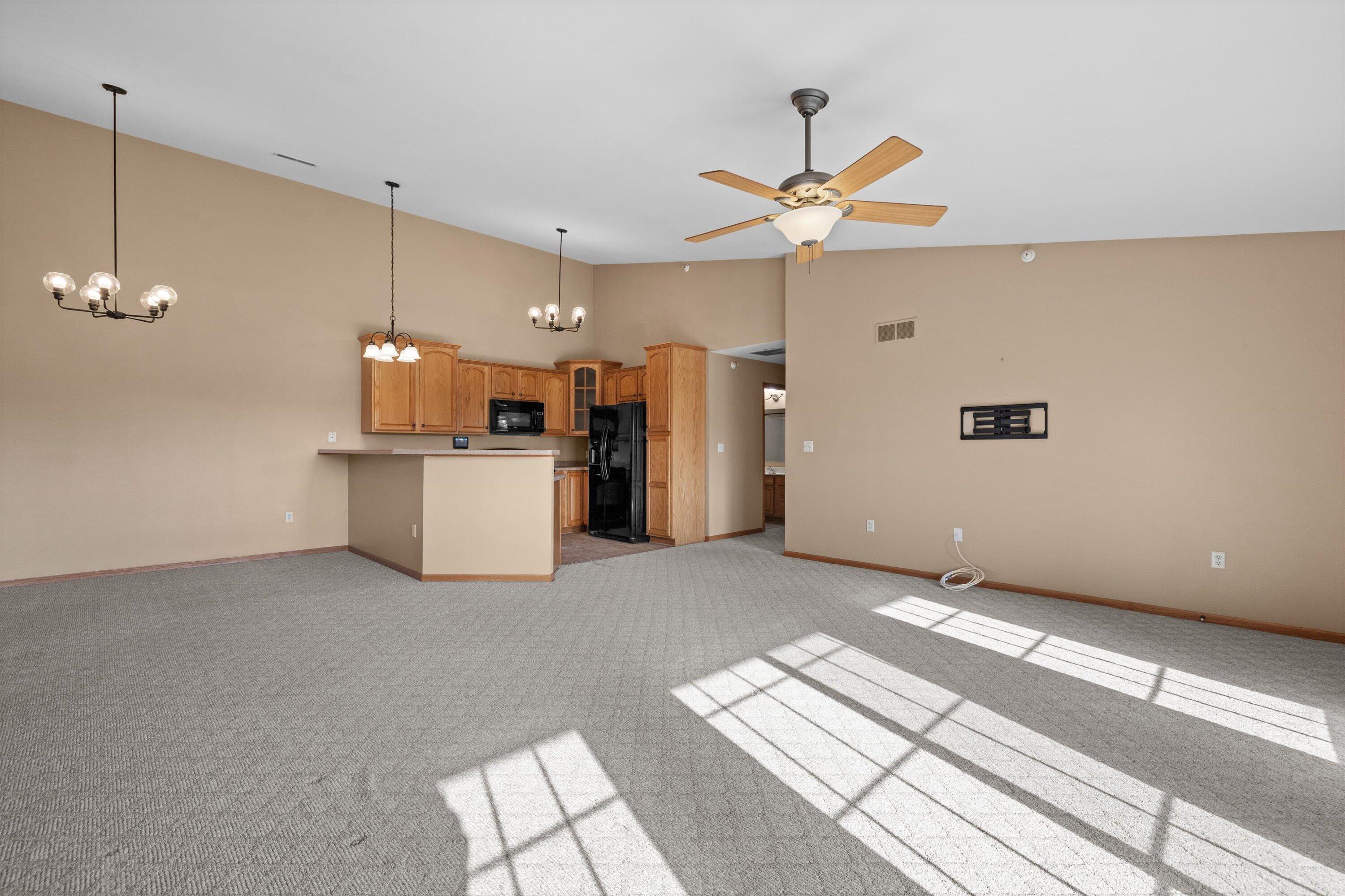 1540 Raintree Lane, Unit 128 Mount Pleasant, WI 53406 - Photo 6 of 31 living room