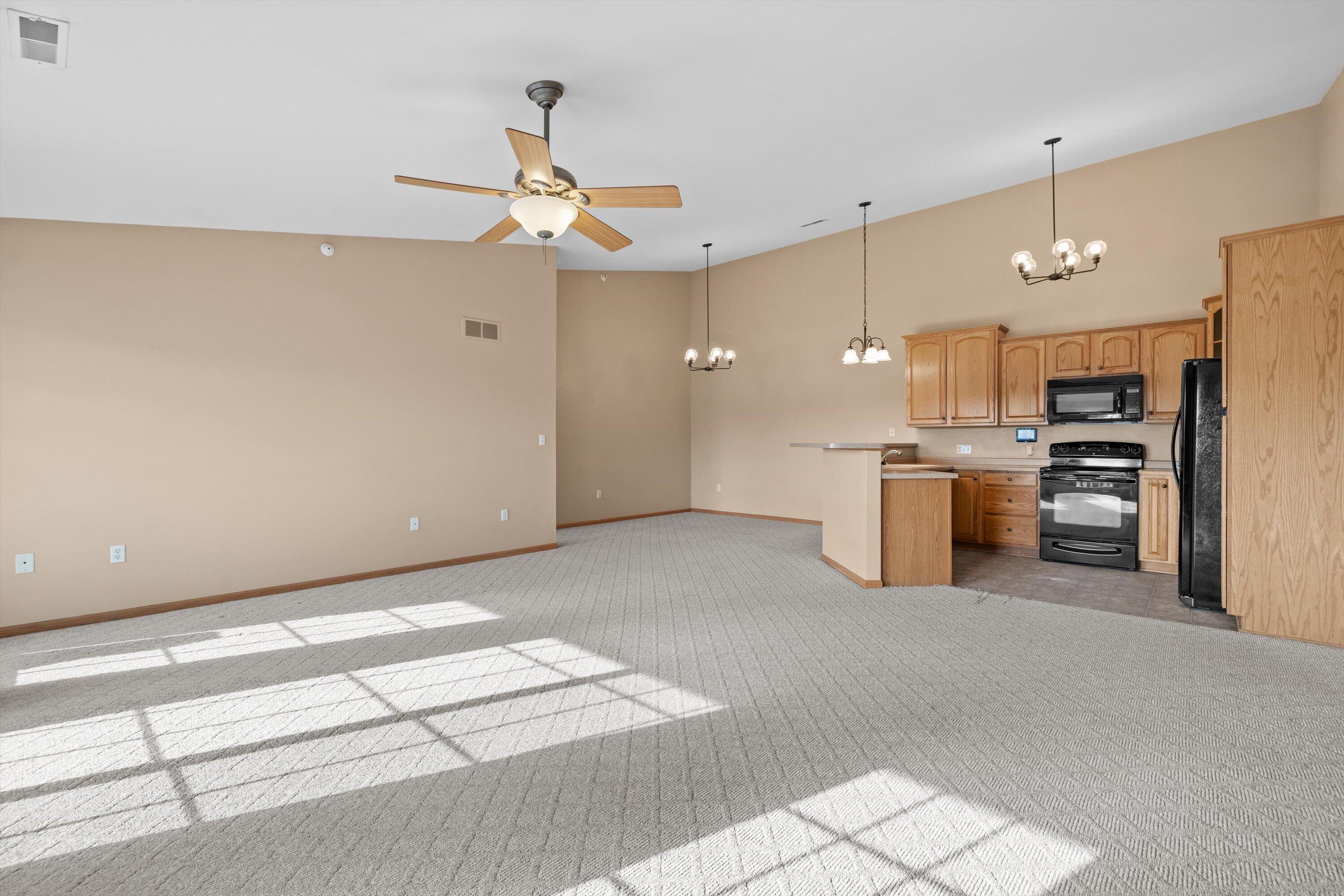 1540 Raintree Lane, Unit 128 Mount Pleasant, WI 53406 - Photo 7 of 31 living room