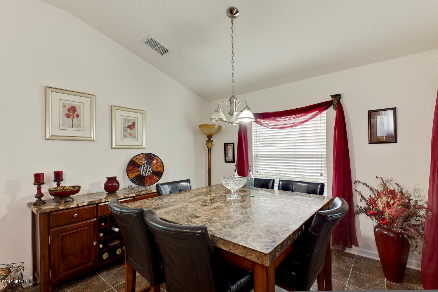 16357 Tisons Bluff Road Jacksonville, FL 32218 - Photo 12 of 31 a view of a kitchen with a table and chairs in it