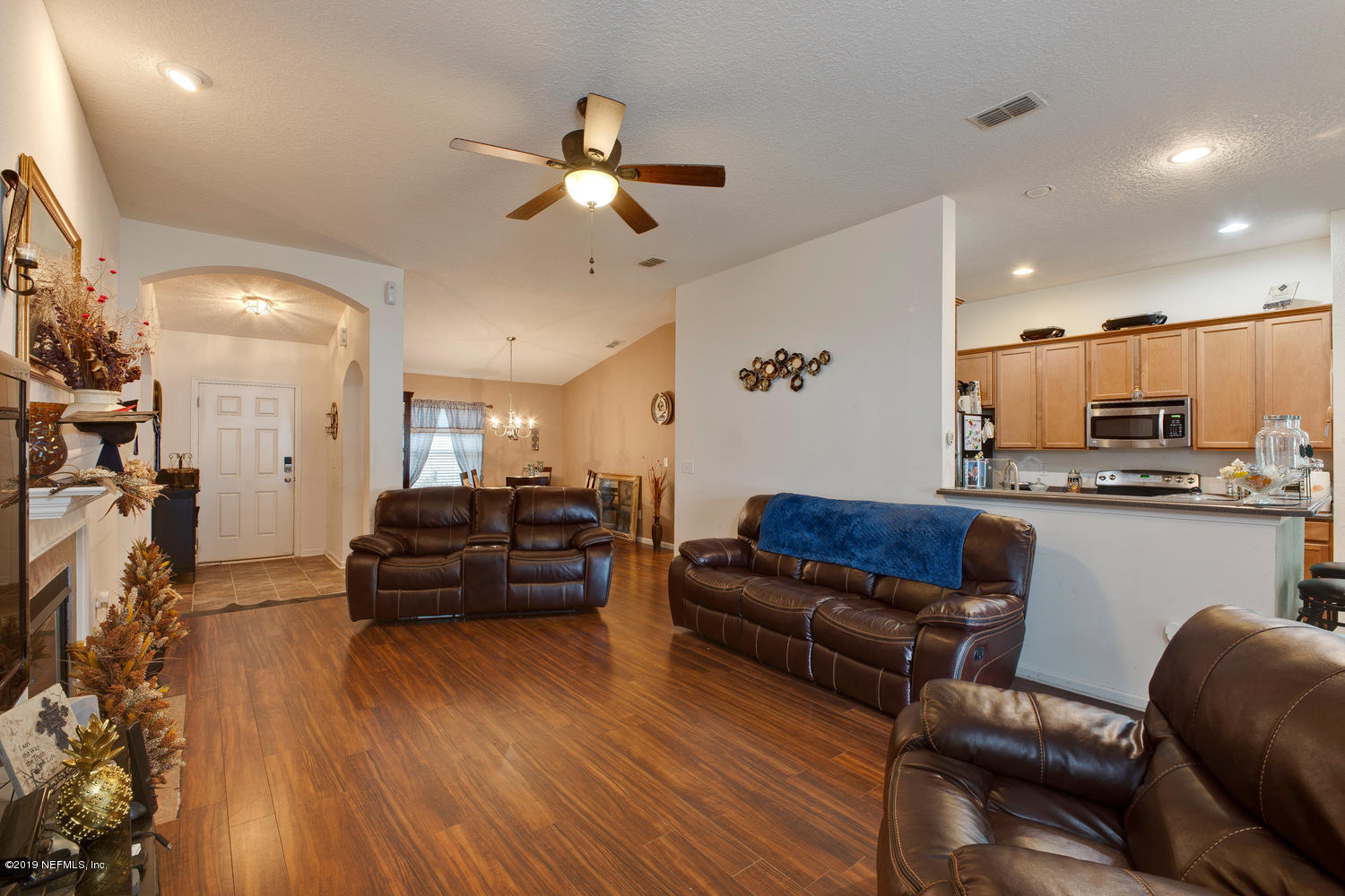 16357 Tisons Bluff Road Jacksonville, FL 32218 - Photo 15 of 31 a living room with furniture and kitchen view