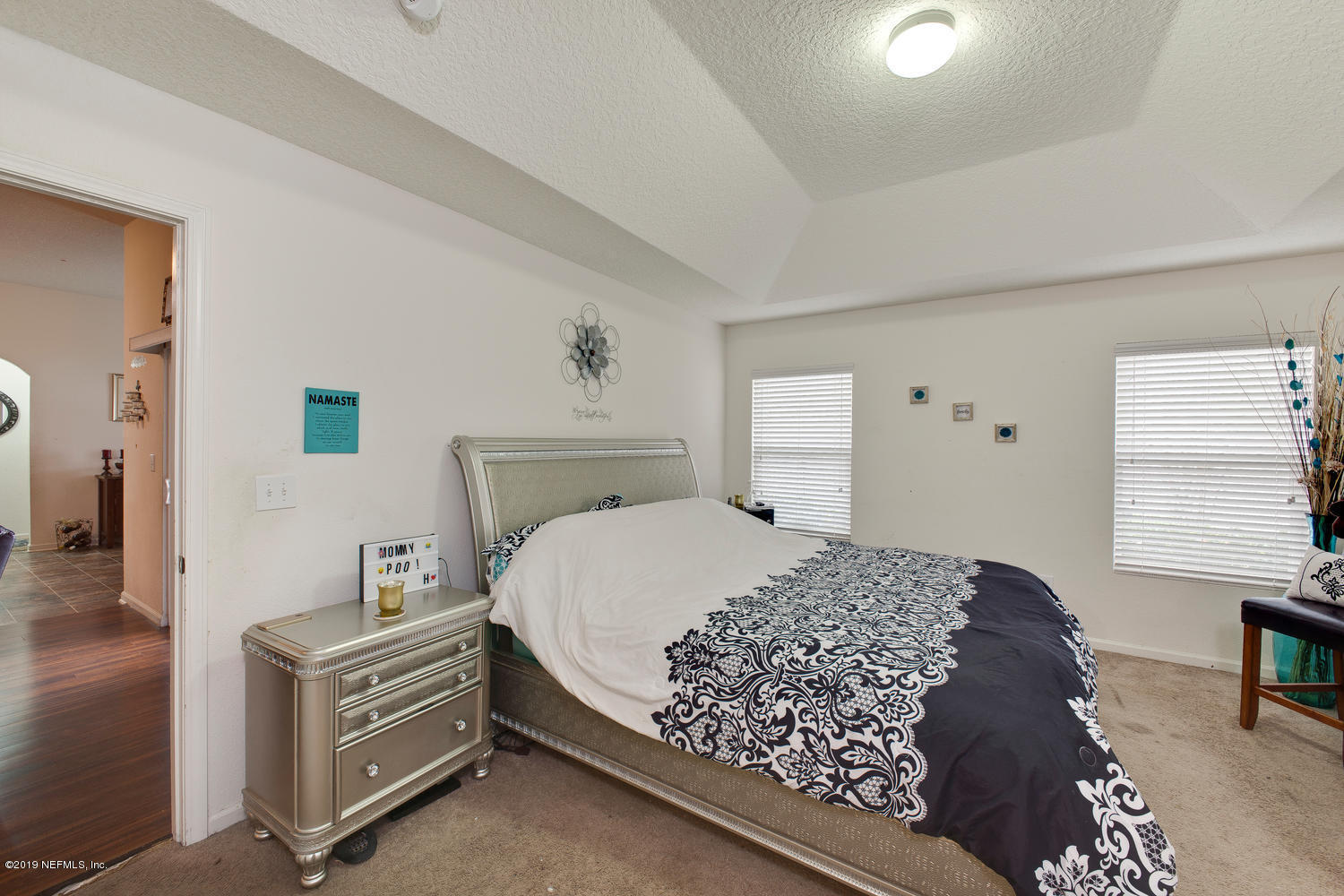 16357 Tisons Bluff Road Jacksonville, FL 32218 - Photo 18 of 31 a bedroom with a bed and dresser