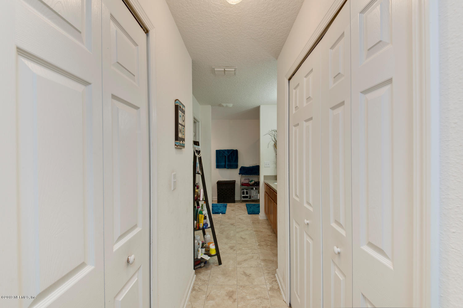 16357 Tisons Bluff Road Jacksonville, FL 32218 - Photo 20 of 31 a view of a livingroom with furniture and a hallway
