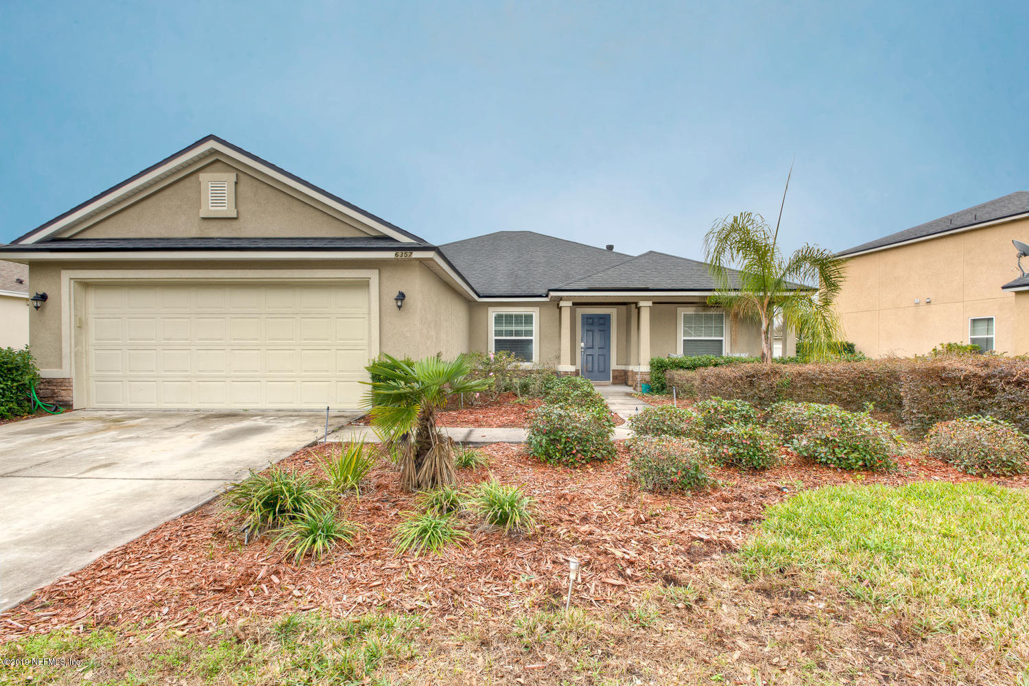 16357 Tisons Bluff Road Jacksonville, FL 32218 - Photo 2 of 31 a front view of a house with garden