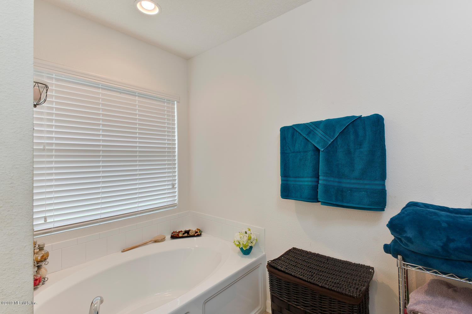 16357 Tisons Bluff Road Jacksonville, FL 32218 - Photo 22 of 31 a bathroom with a bathtub and a window