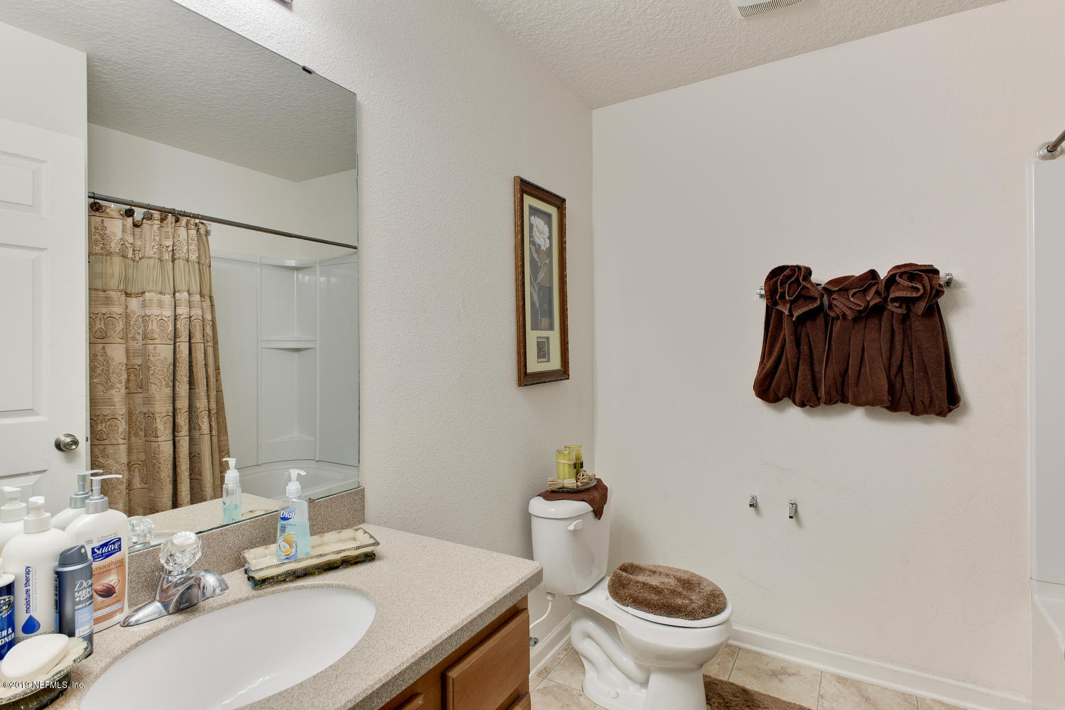 16357 Tisons Bluff Road Jacksonville, FL 32218 - Photo 24 of 31 a bathroom with a sink toilet and mirror