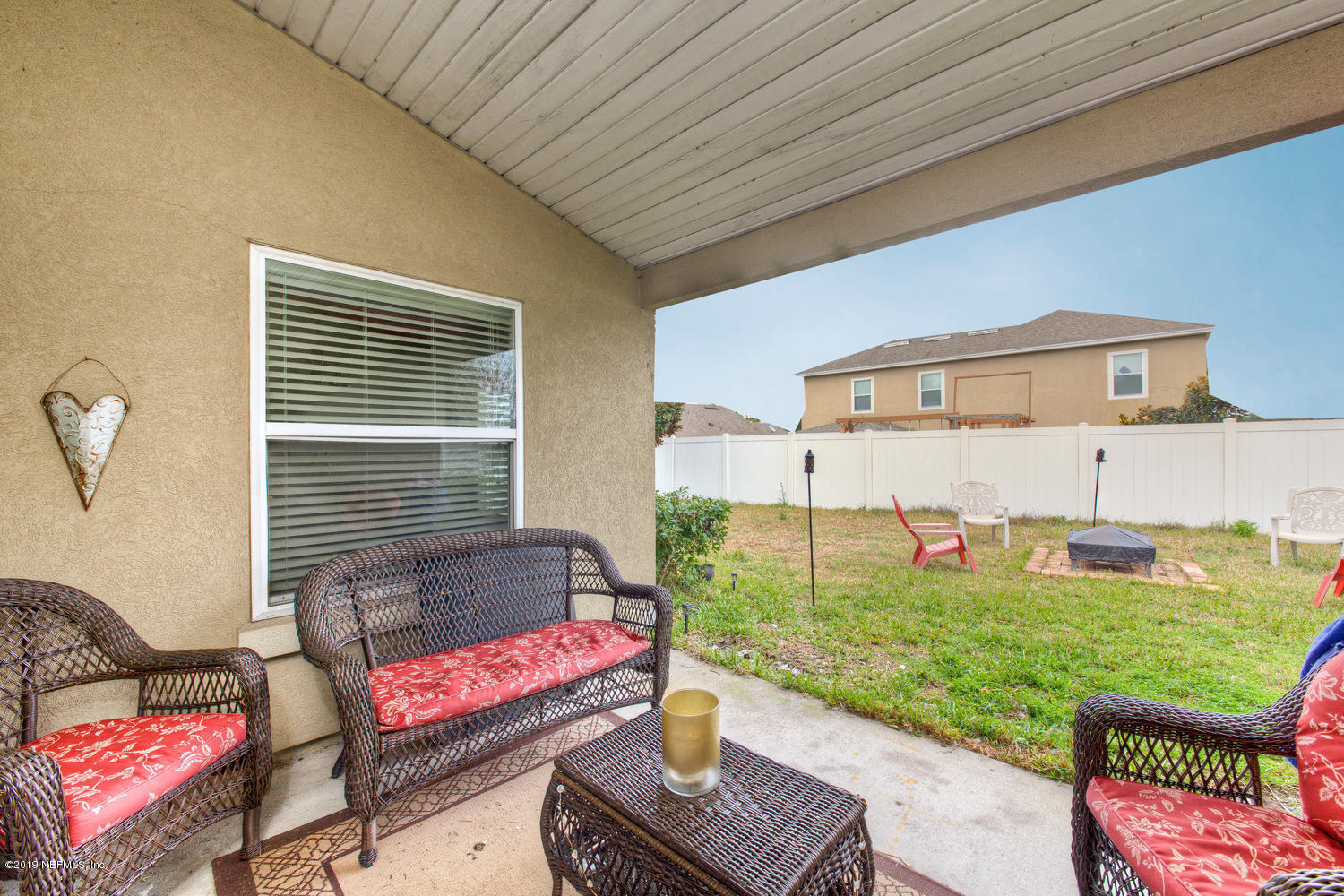 16357 Tisons Bluff Road Jacksonville, FL 32218 - Photo 26 of 31 a view of a patio with chairs and a potted plant