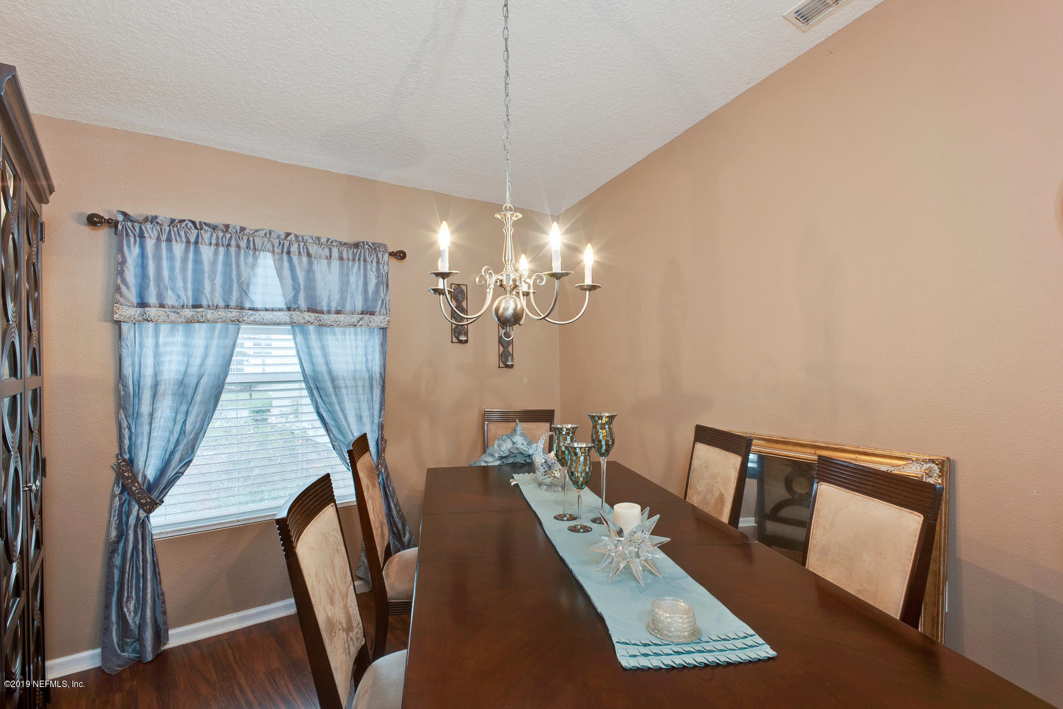 16357 Tisons Bluff Road Jacksonville, FL 32218 - Photo 4 of 31 a view of a dining room with furniture window and wooden floor