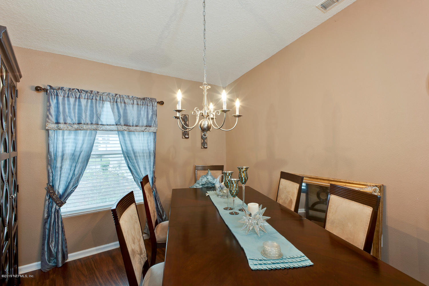 16357 Tisons Bluff Road Jacksonville, FL 32218 - Photo 5 of 31 a view of a dining room with furniture window and wooden floor