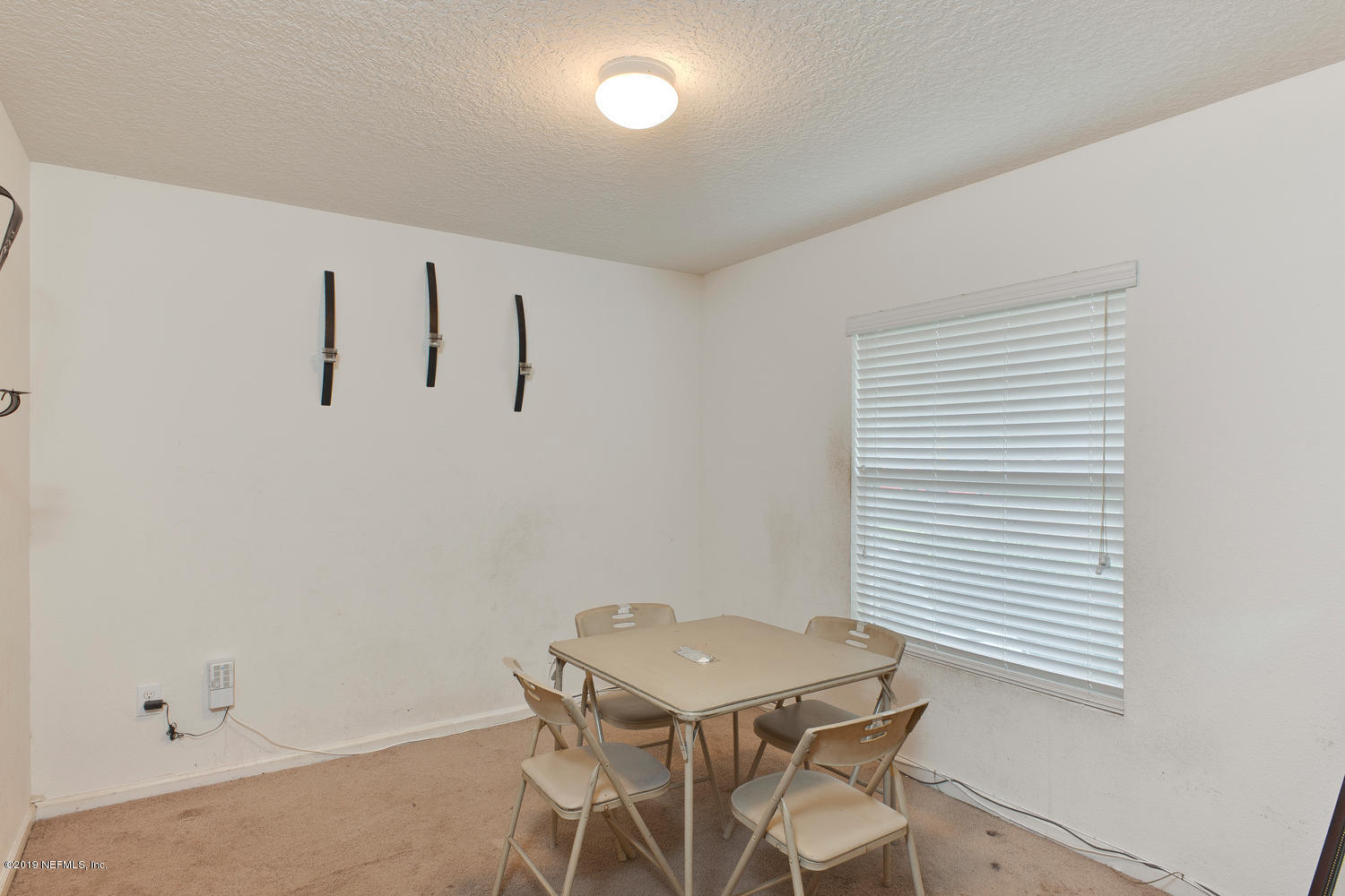 16357 Tisons Bluff Road Jacksonville, FL 32218 - Photo 7 of 31 a view of a room with gym equipment