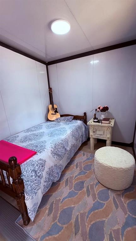 149 South Oak Tree Kemp, TX 75143 - Photo 13 of 14 a bedroom with two bed and a couch