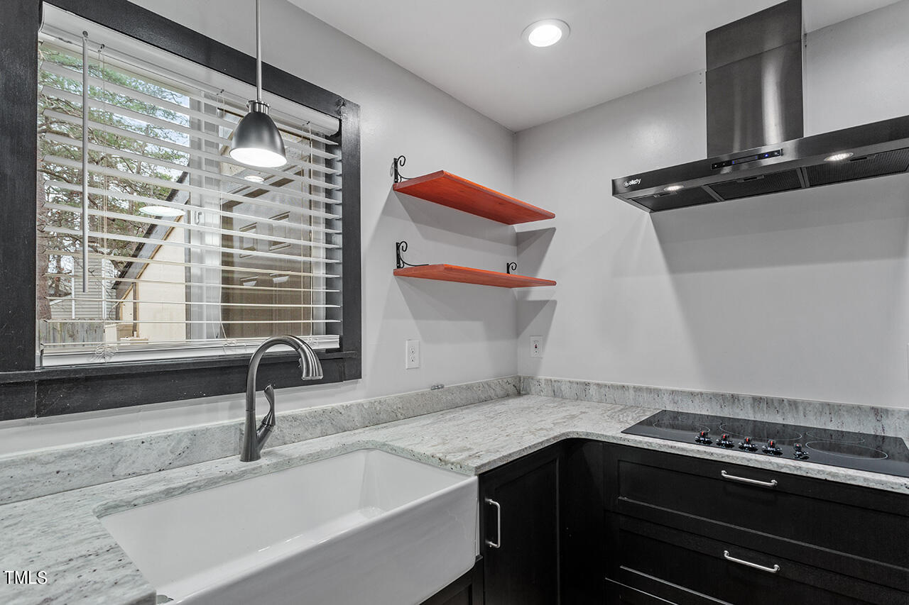 4274 Lake Ridge Drive Raleigh, NC 27604 - Photo 14 of 32 a kitchen with a sink and a stove