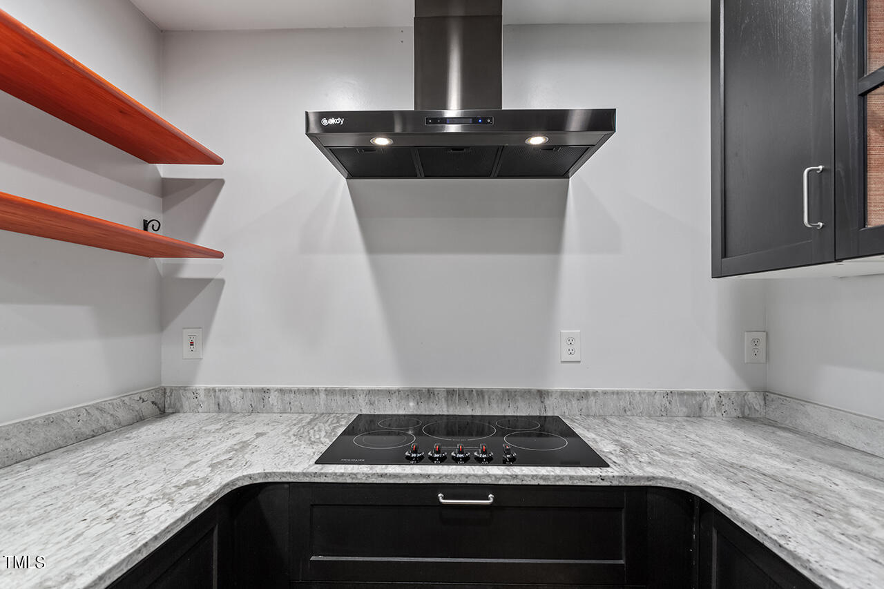 4274 Lake Ridge Drive Raleigh, NC 27604 - Photo 15 of 32 a kitchen with granite countertop a sink stainless steel appliances and cabinets