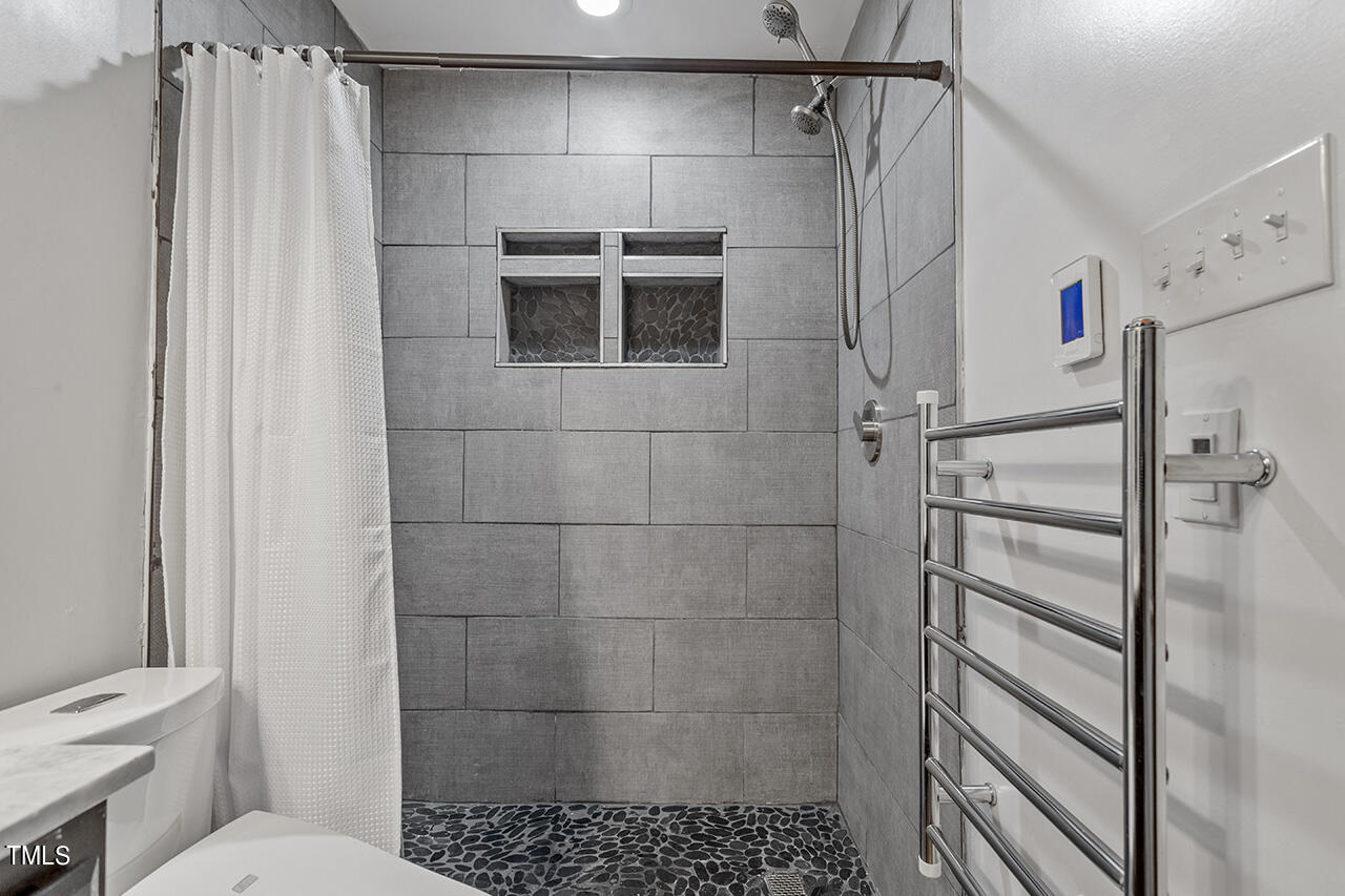 4274 Lake Ridge Drive Raleigh, NC 27604 - Photo 26 of 32 a bathroom with a shower toilet and sink