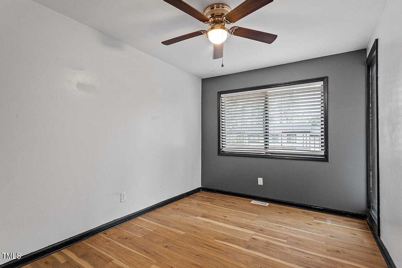 4274 Lake Ridge Drive Raleigh, NC 27604 - Photo 27 of 32 wooden floor in an empty room with a window