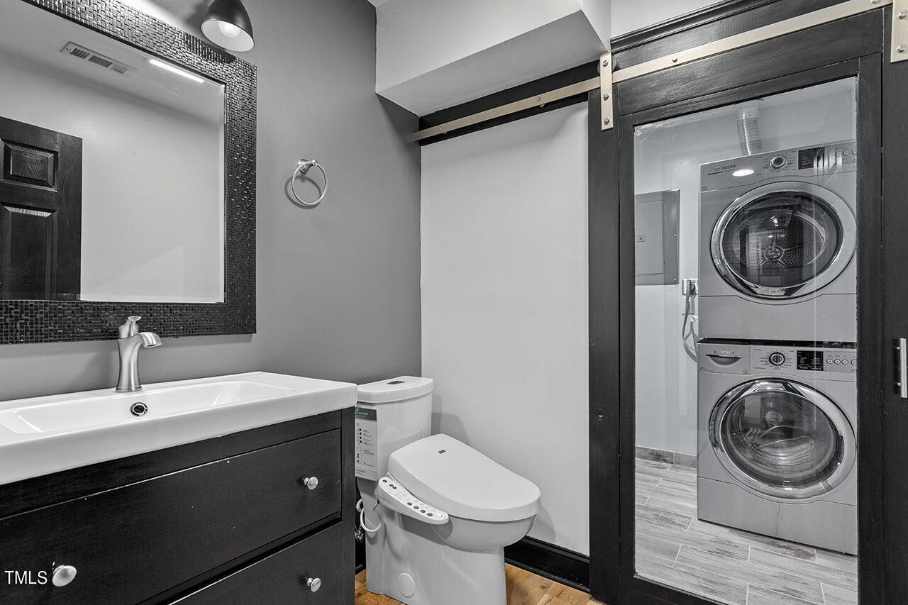 4274 Lake Ridge Drive Raleigh, NC 27604 - Photo 10 of 32 a bathroom with a sink a toilet and a mirror