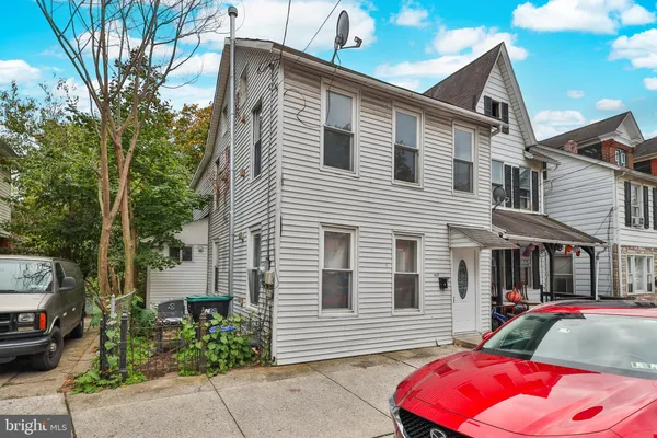 a front view of a house with a garage