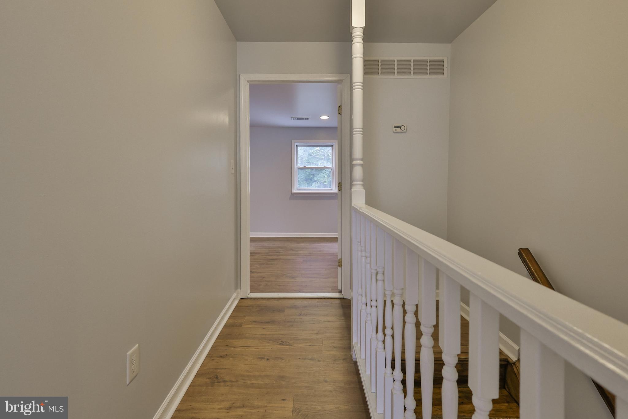 427 Pawnee Street Bethlehem, PA 18015 - Photo 18 of 39 a view of a hallway with wooden floor and entryway