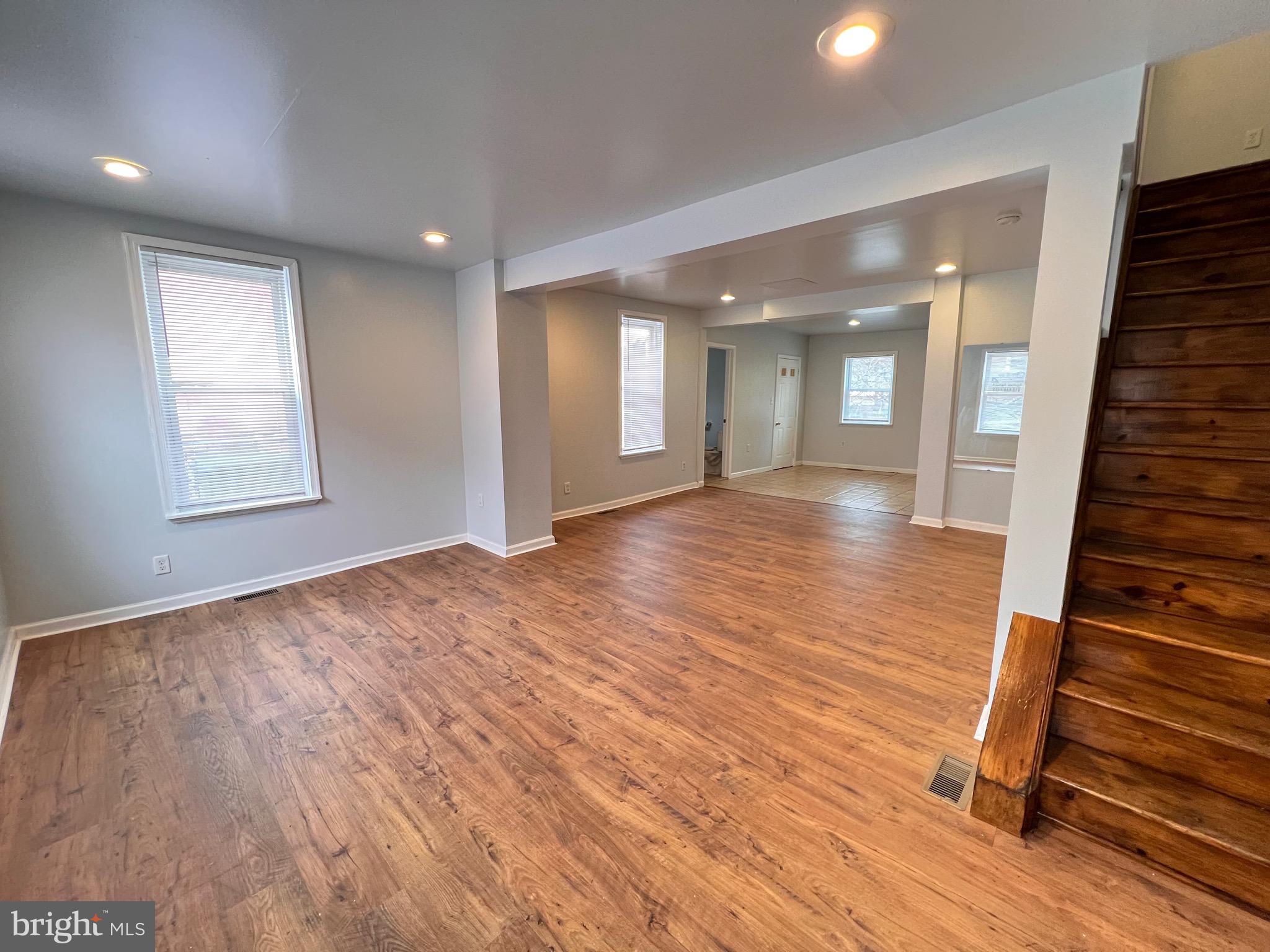 427 Pawnee Street Bethlehem, PA 18015 - Photo 2 of 39 an empty room with wooden floor and windows