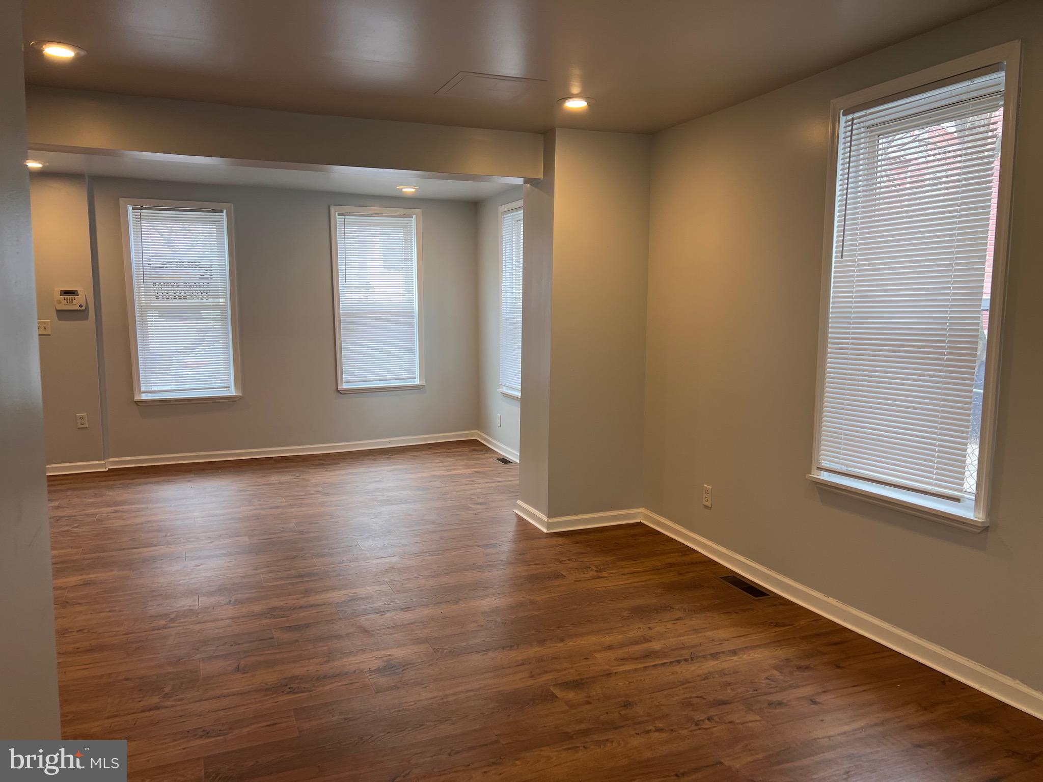 427 Pawnee Street Bethlehem, PA 18015 - Photo 21 of 39 an empty room with wooden floor and windows