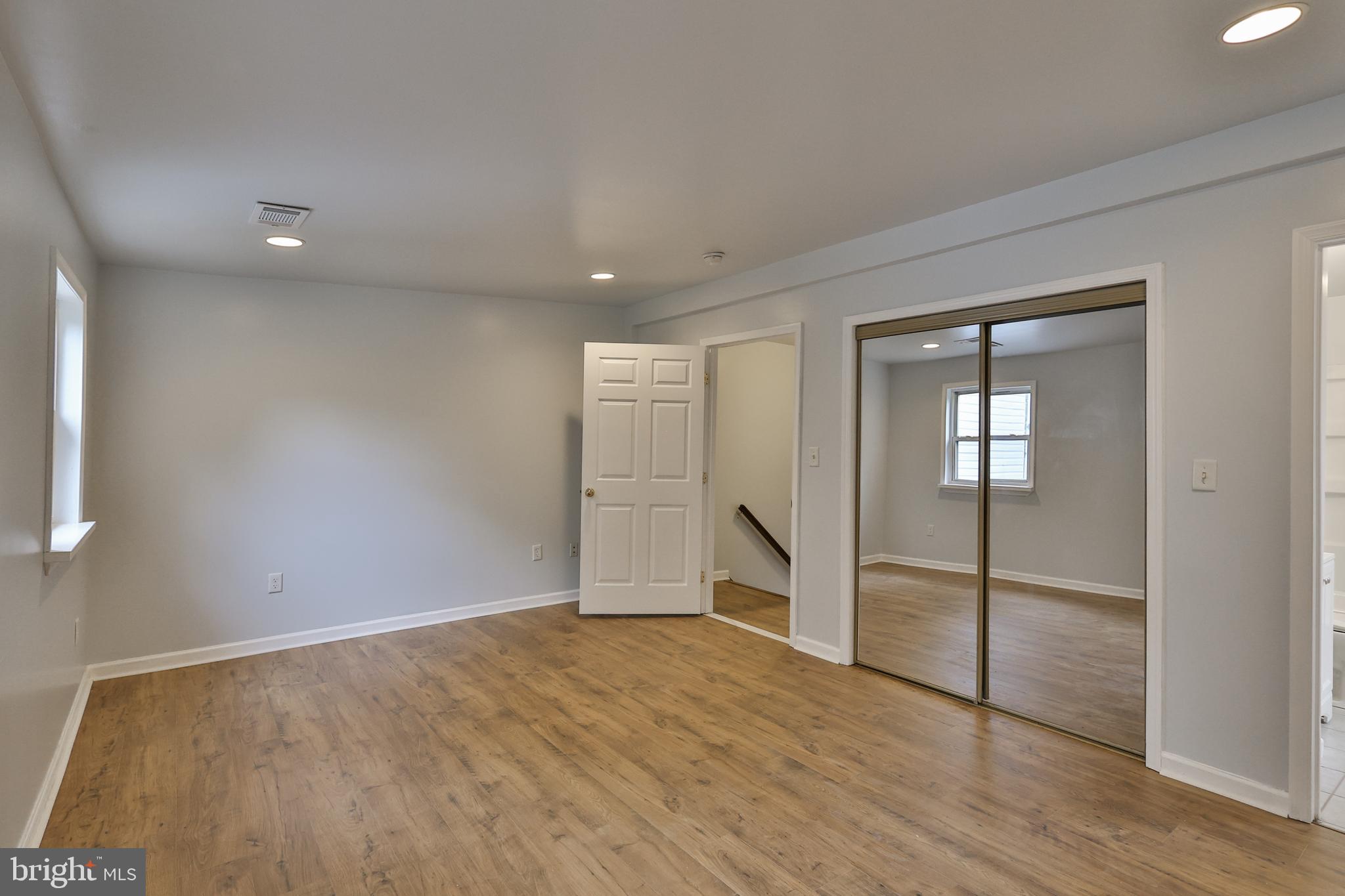 427 Pawnee Street Bethlehem, PA 18015 - Photo 23 of 39 wooden floor in an empty room with a window