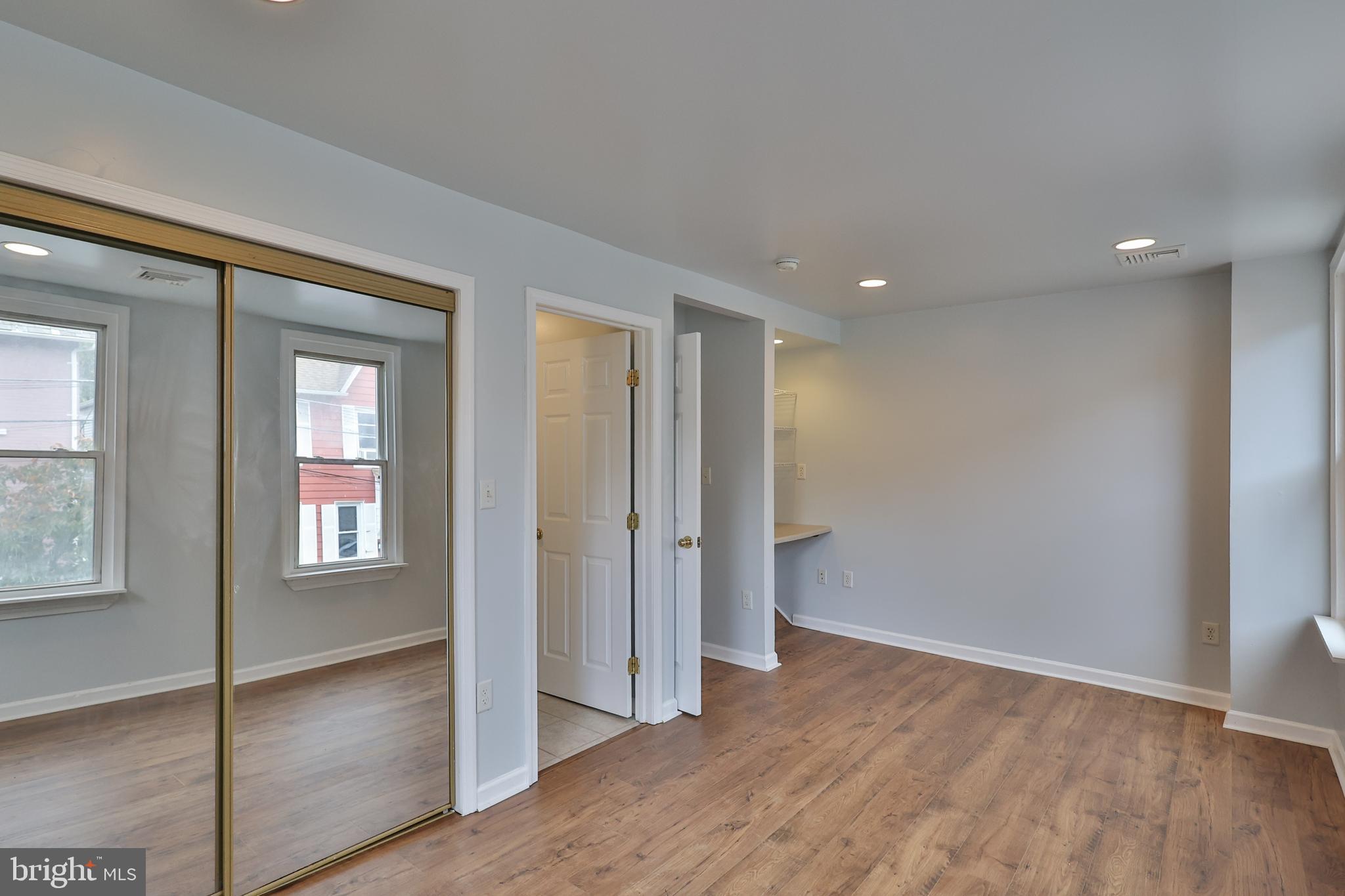 427 Pawnee Street Bethlehem, PA 18015 - Photo 26 of 39 an empty room with wooden floor and windows
