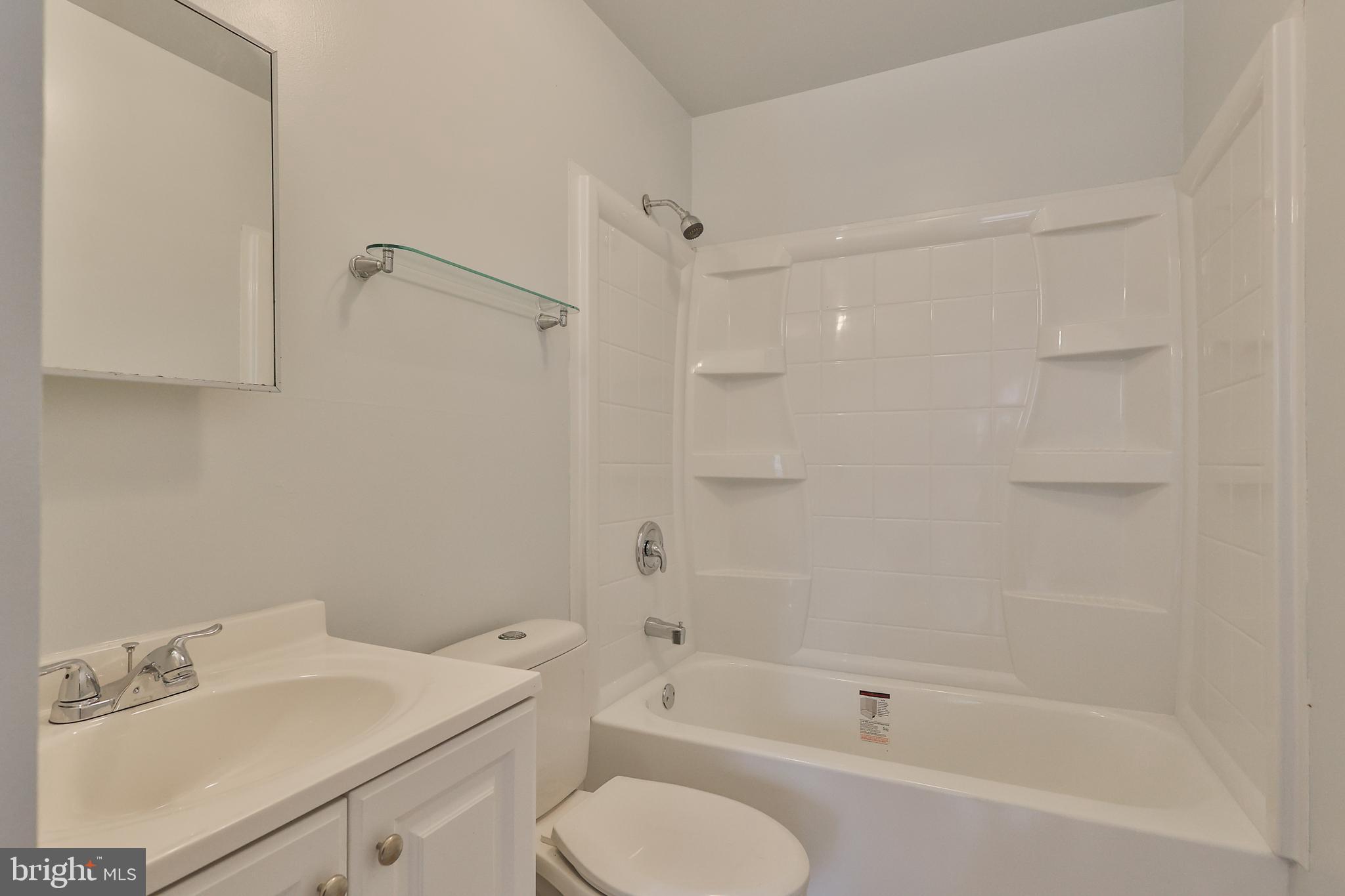 427 Pawnee Street Bethlehem, PA 18015 - Photo 28 of 39 a bathroom with a bathtub shower sink vanity and toilet