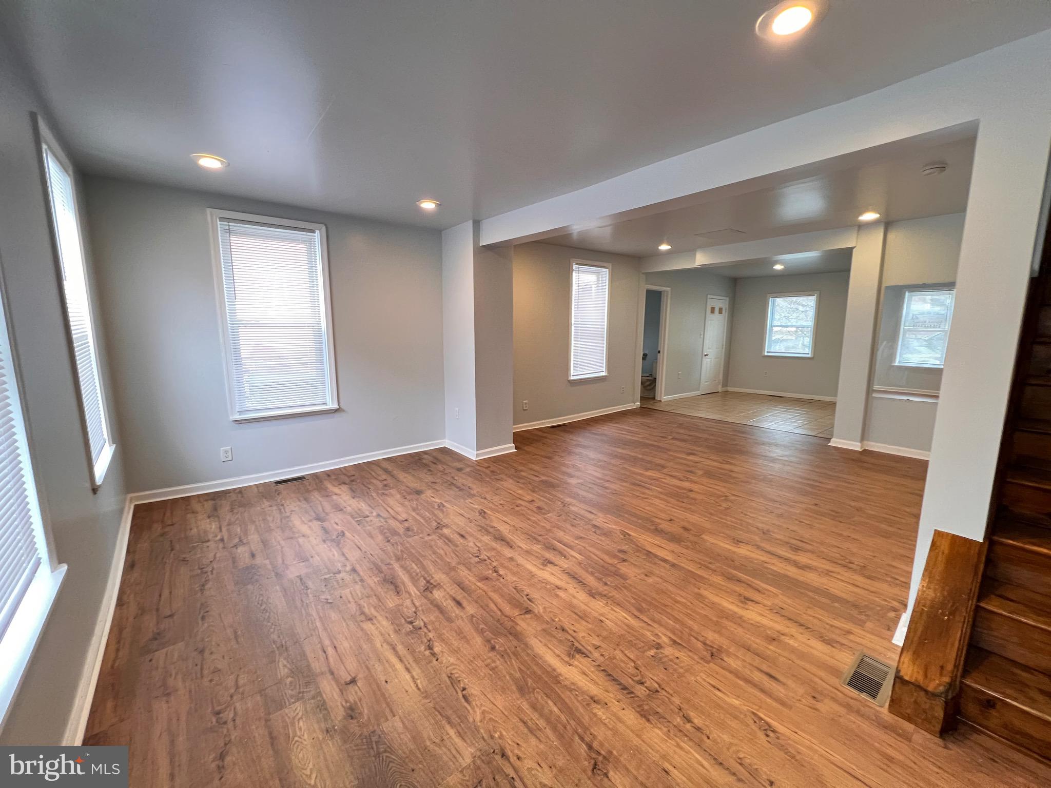 427 Pawnee Street Bethlehem, PA 18015 - Photo 3 of 39 an empty room with wooden floor and windows