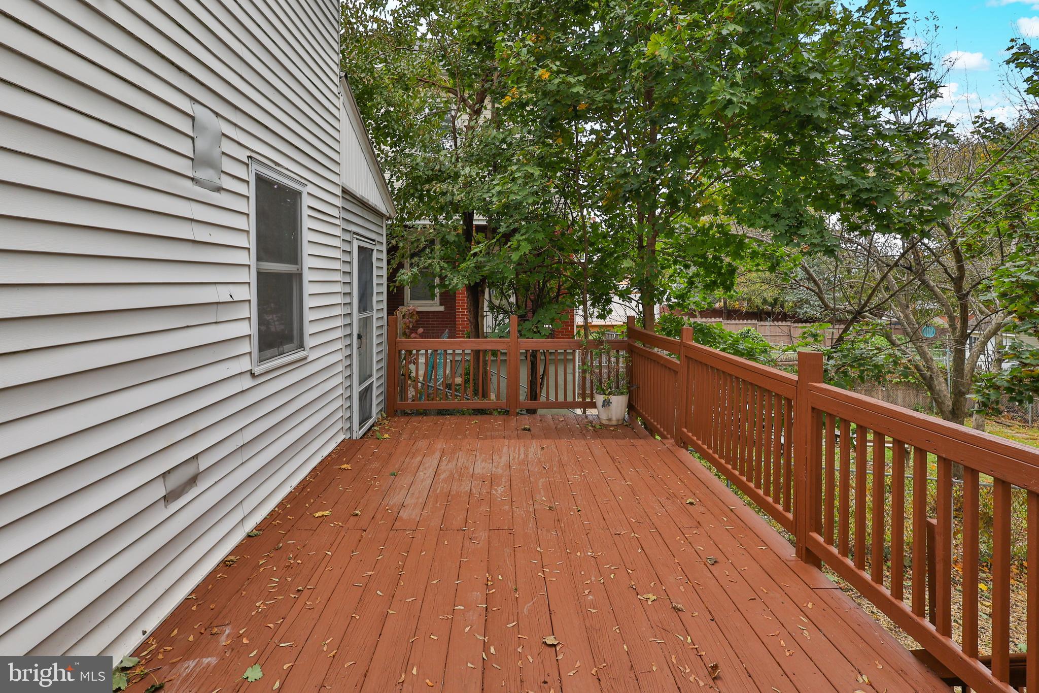 427 Pawnee Street Bethlehem, PA 18015 - Photo 33 of 39 a view of a wooden deck with a yard