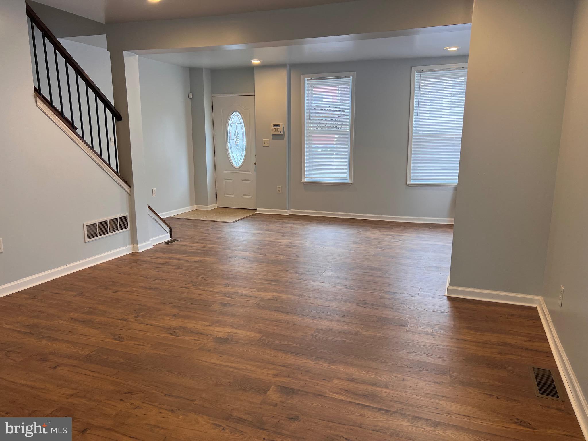427 Pawnee Street Bethlehem, PA 18015 - Photo 6 of 39 a view of an empty room with wooden floor and a window